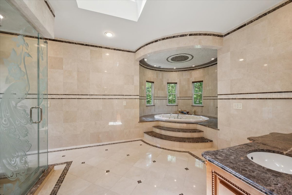 115 Skyline Drive Watchung, NJ 07069 - Photo 53 of 95 a bathroom with a granite countertop sink and a mirror