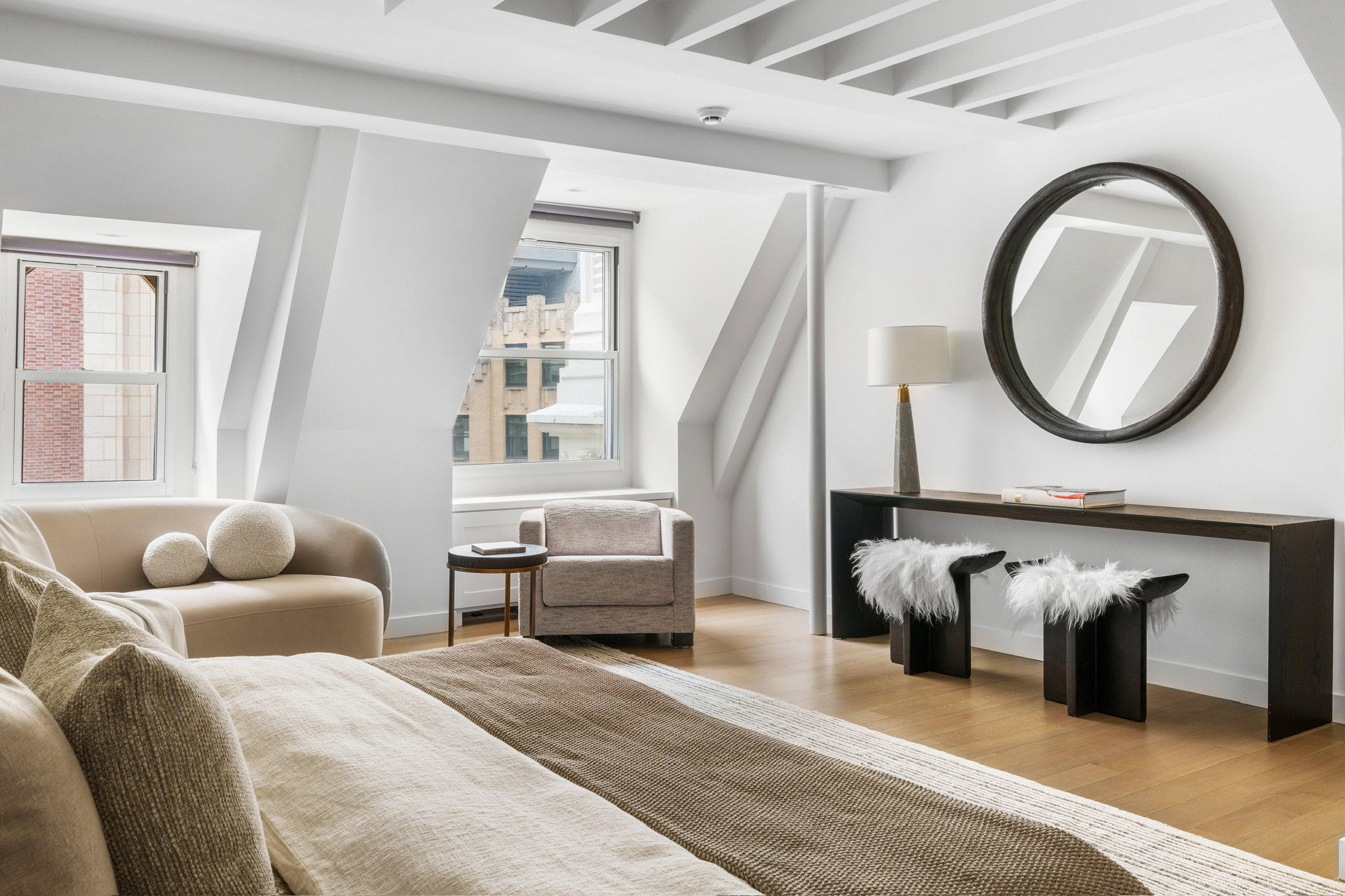 1200 Broadway, Unit PH89 Manhattan, NY 10001 - Photo 23 of 47 a bedroom with furniture and a couch