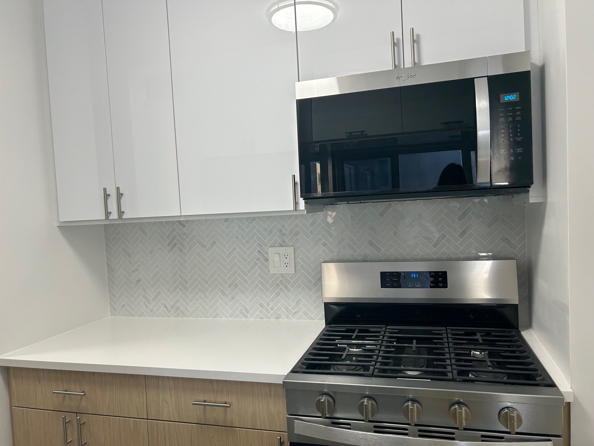 400 East 54th Street, Unit 19H Manhattan, NY 10022 - Photo 11 of 19 a stove top oven sitting inside of a kitchen