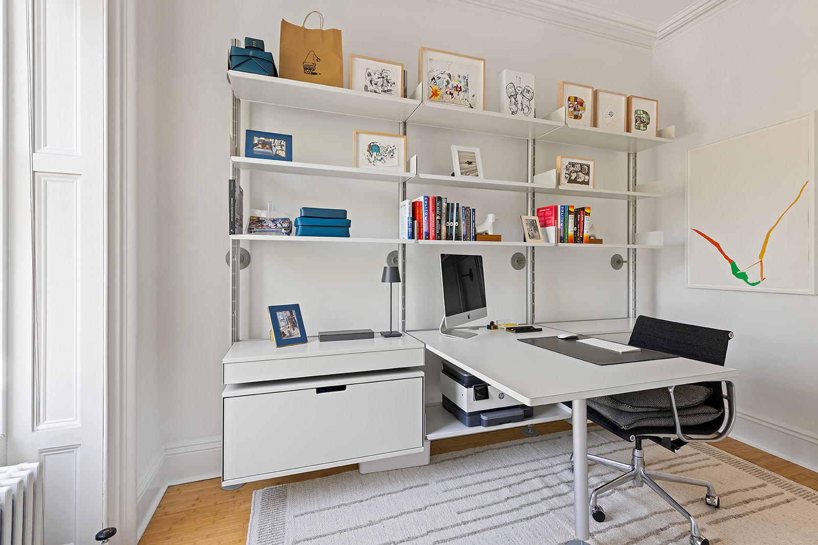 315 Adelphi Street, Unit 2 Brooklyn, NY 11205 - Photo 5 of 12 a workspace with furniture and baby crib