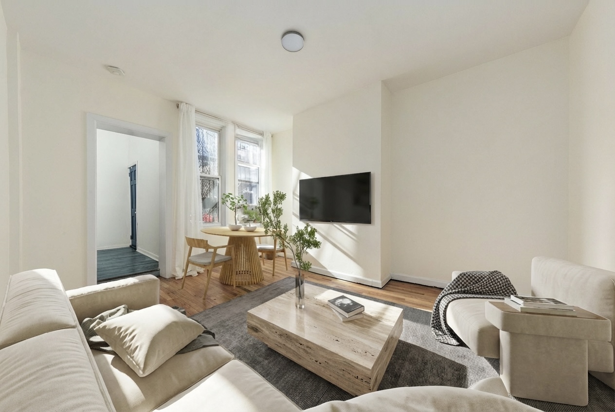 1218 Saint Marks Avenue Brooklyn, NY 11213 - Photo 18 of 42 a living room with furniture and a flat screen tv