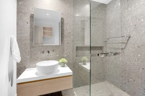 a bathroom with a sink and a shower
