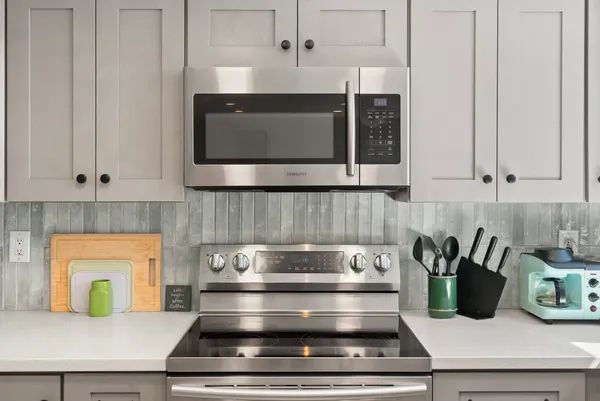 a kitchen with a stove and a microwave