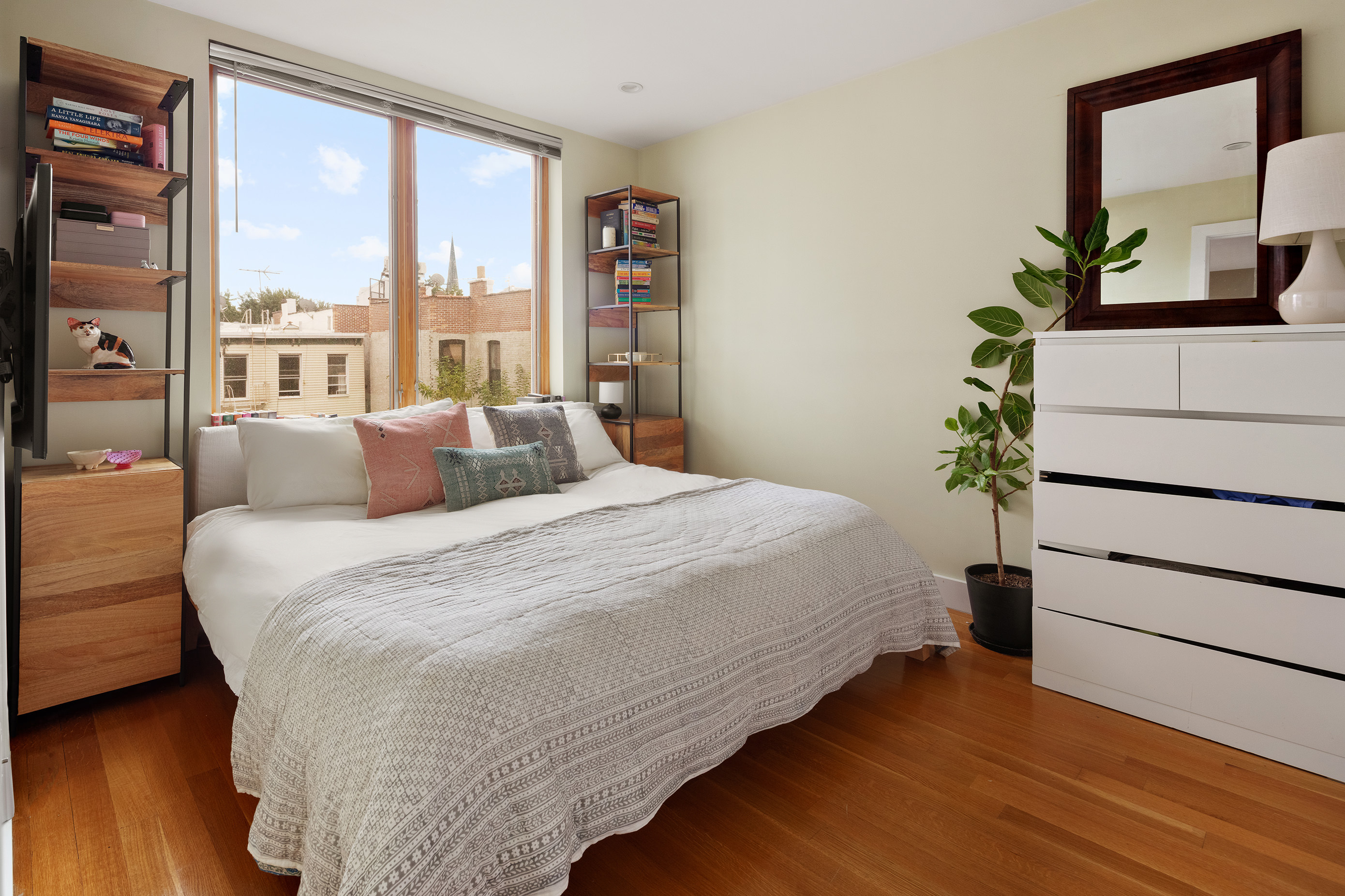 184 India Street, Unit 4B Brooklyn, NY 11222 - Photo 4 of 6 a bedroom with bed and large window