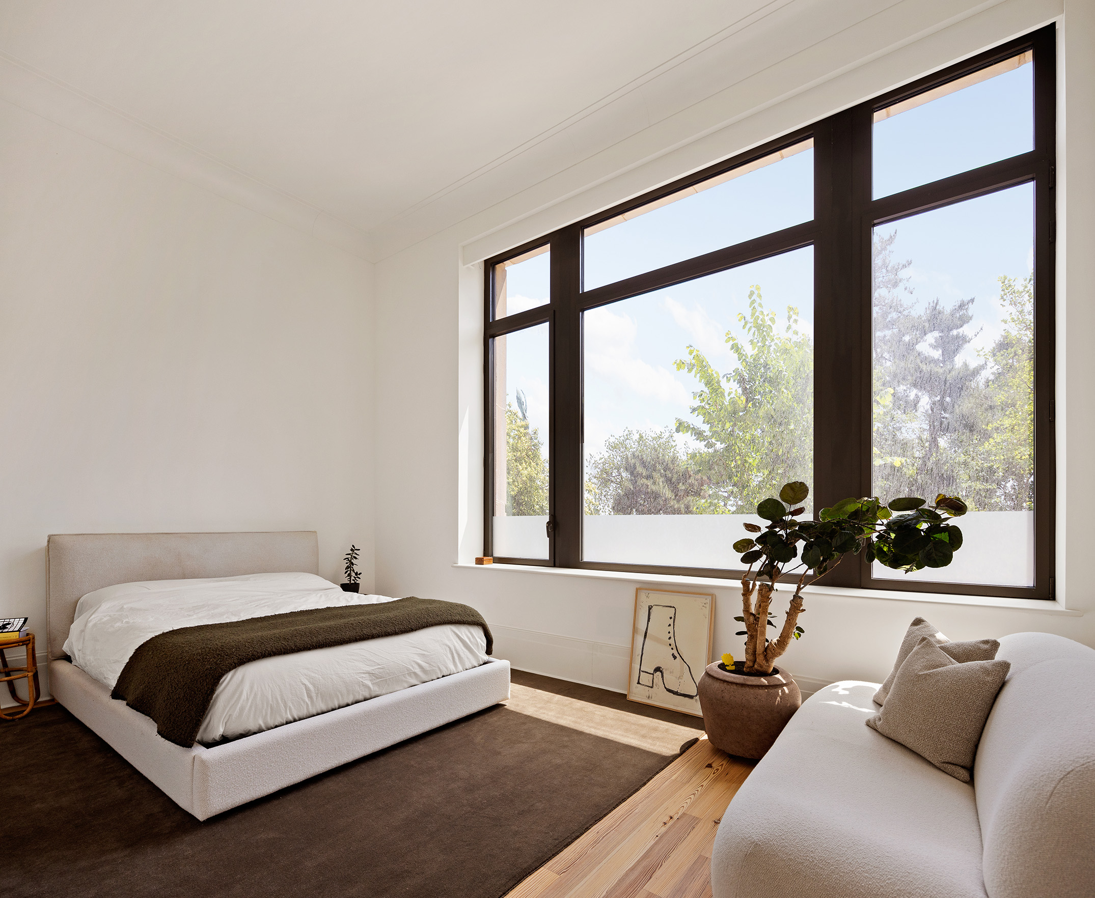 1 Prospect Park West, Unit 2A Brooklyn, NY 11215 - Photo 8 of 17 a spacious bedroom with a bed and a large window