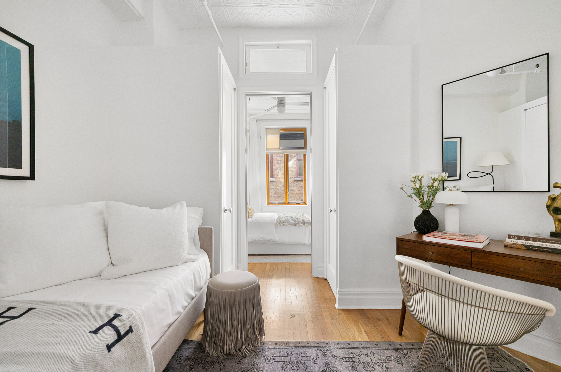 107 West 25th Street, Unit 5B Manhattan, NY 10001 - Photo 11 of 16 a living room with furniture and a window