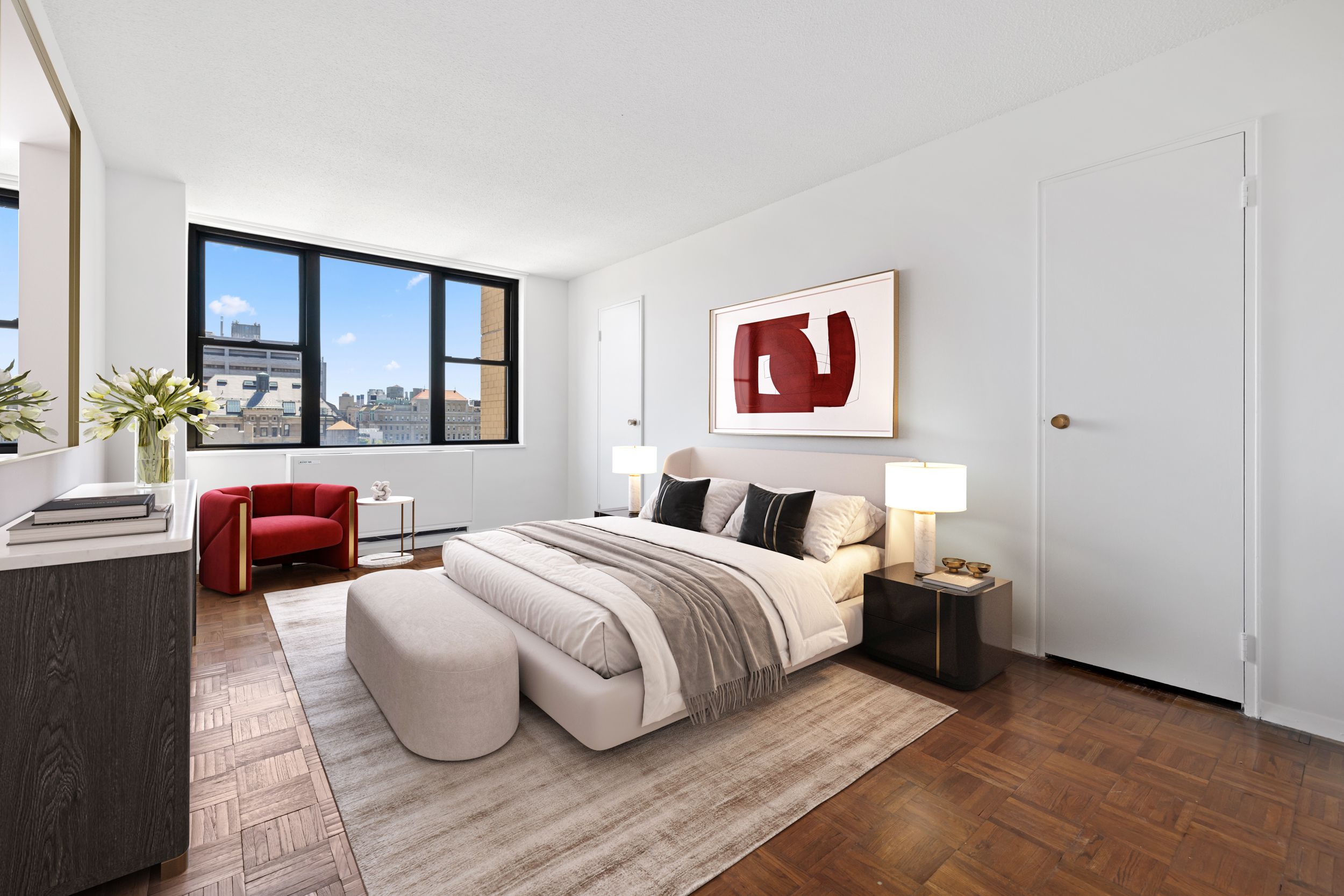 201 East 17th Street, Unit 15H Manhattan, NY 10003 - Photo 5 of 24 a spacious bedroom with a bed and a large window