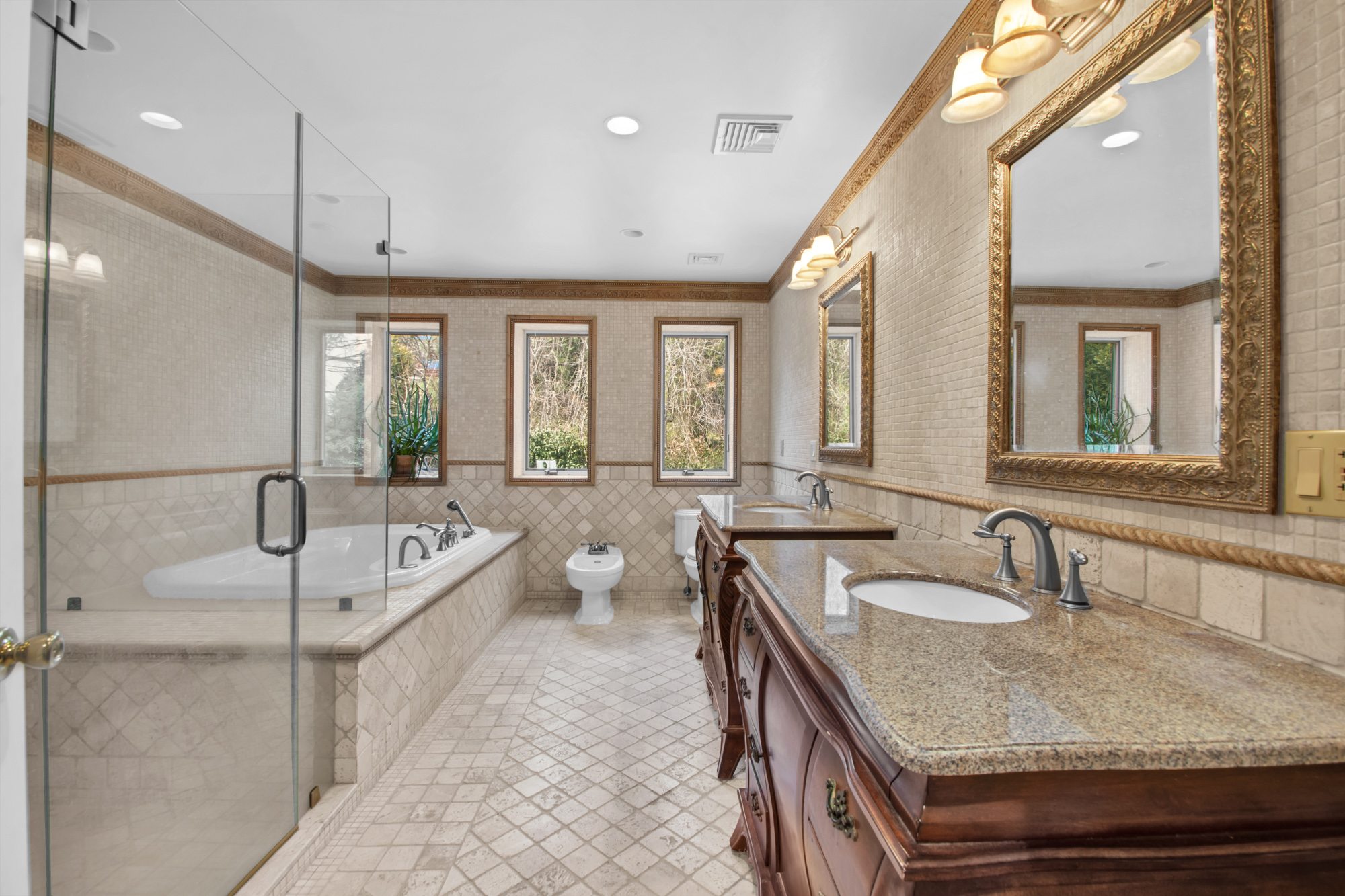 68 Circle Road Staten Island, NY 10304 - Photo 18 of 38 a en suite bathroom with a granite countertop tub sink and mirror