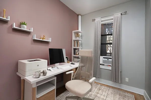 a view of a workspace with furniture