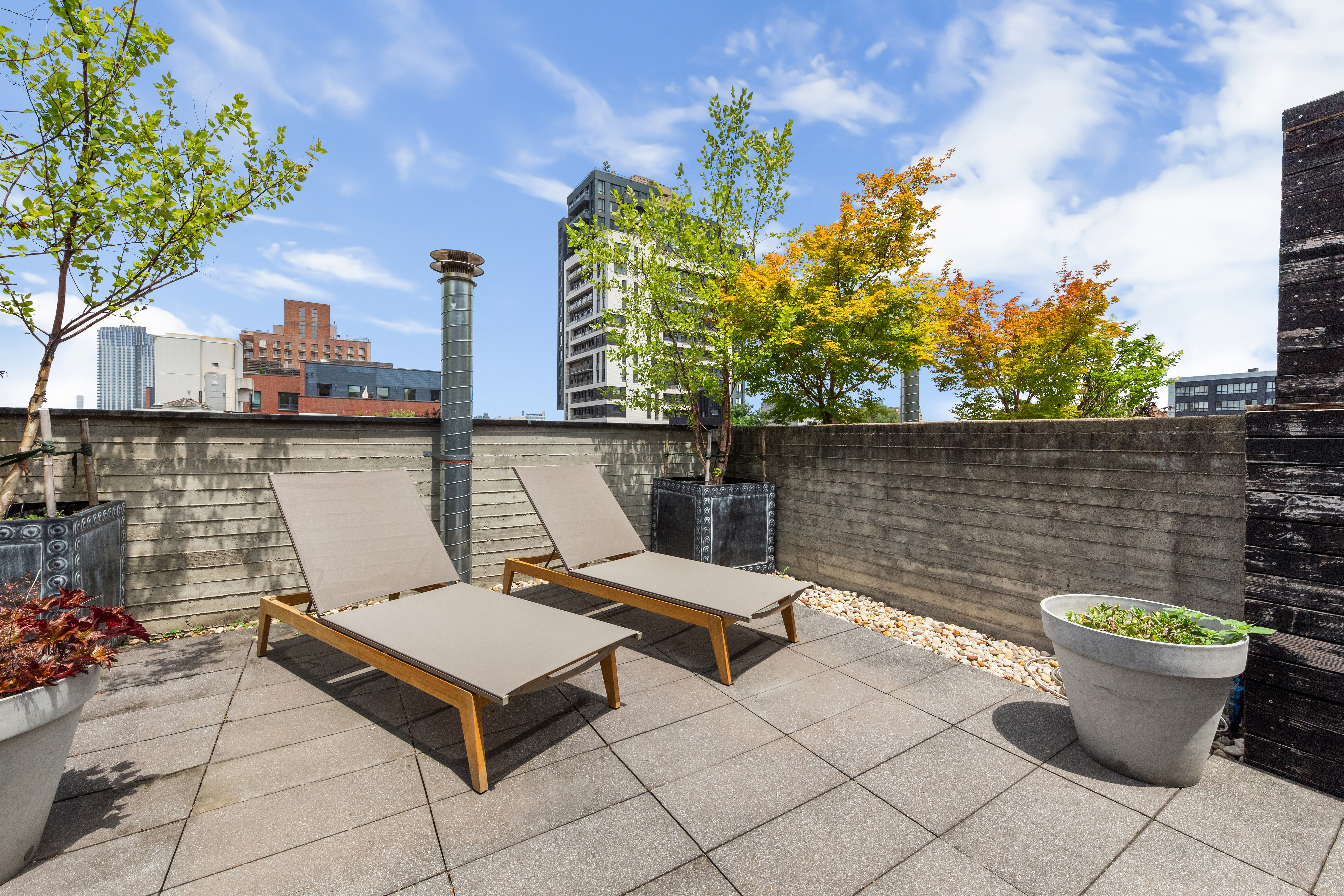 3 Wythe Lane Brooklyn, NY 11249 - Photo 20 of 30 a view of a patio with two chairs and a potted plant