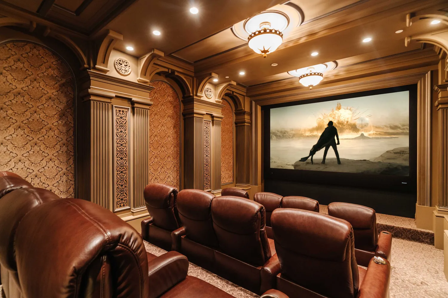 a media room with lots of chairs and a projector screen