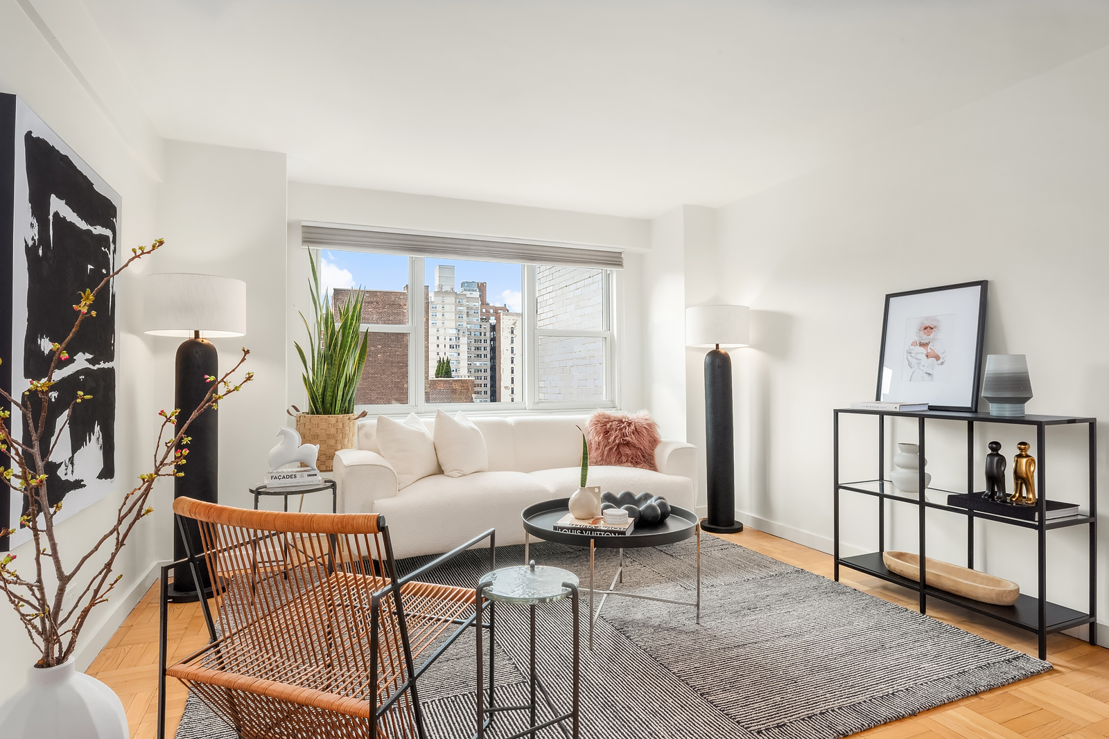 101 West 12th Street, Unit 10F Manhattan, NY 10011 - Photo 3 of 12 a living room with furniture and a window