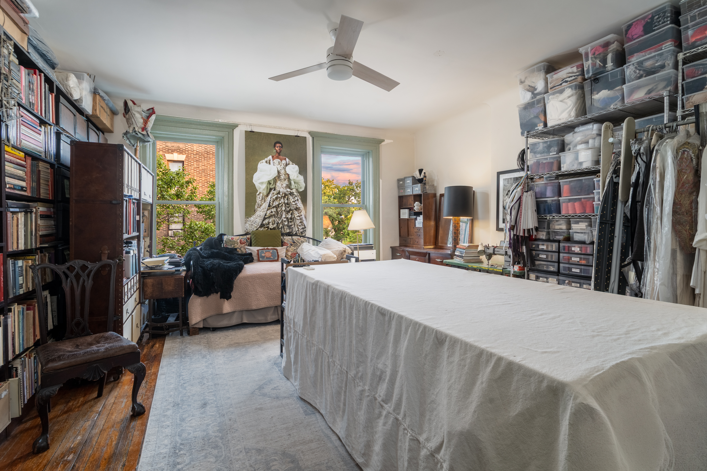 426 West 160th Street Manhattan, NY 10032 - Photo 21 of 33 a living room with lots of furniture and a flat screen tv