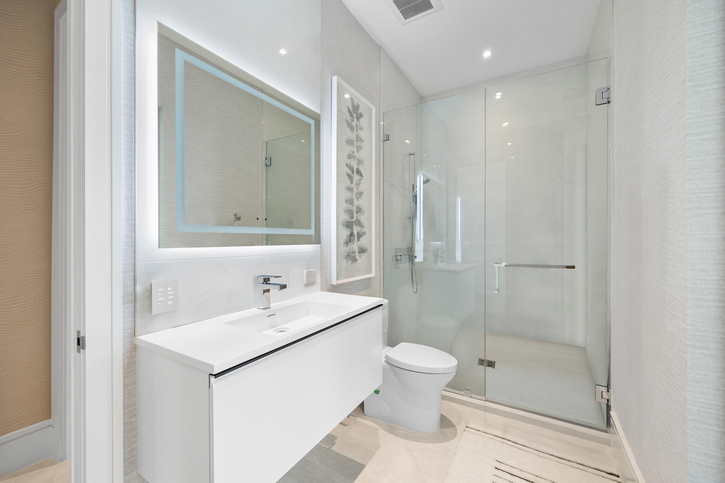 5695 Pennock Point Road Jupiter, FL 33458 - Photo 55 of 77 a bathroom with a sink a toilet and shower