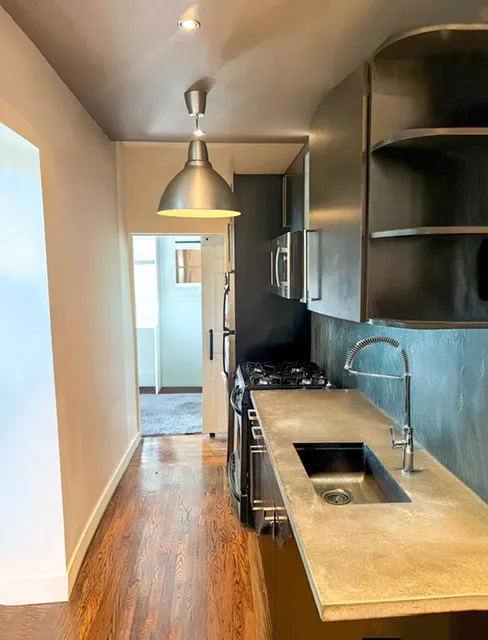 a kitchen with a stove and a refrigerator