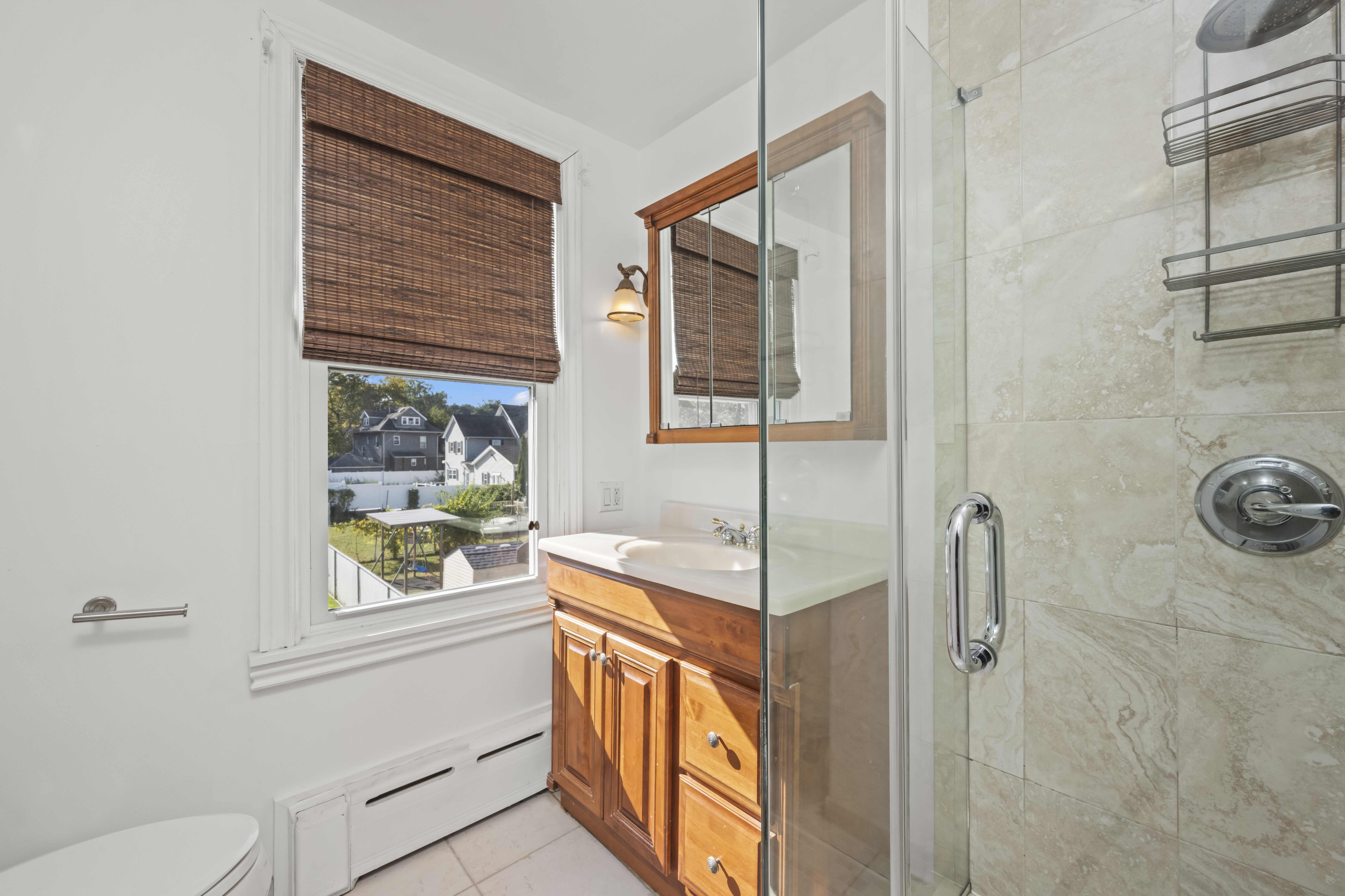 704 Delafield Avenue Staten Island, NY 10310 - Photo 16 of 35 a bathroom with a bathtub and a shower