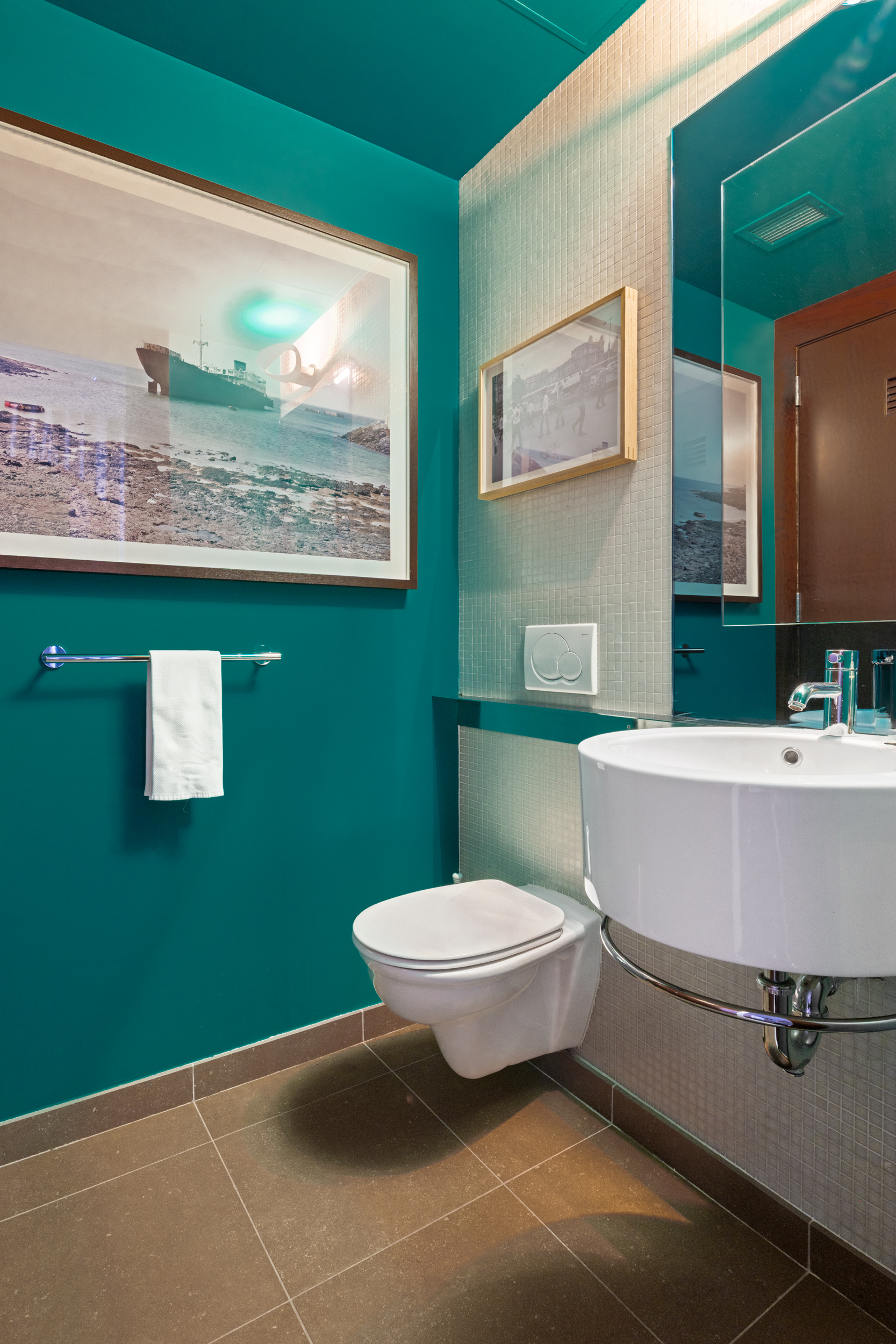 462 West 58th Street, Unit 9B Manhattan, NY 10019 - Photo 14 of 17 a bathroom with a toilet sink and mirror