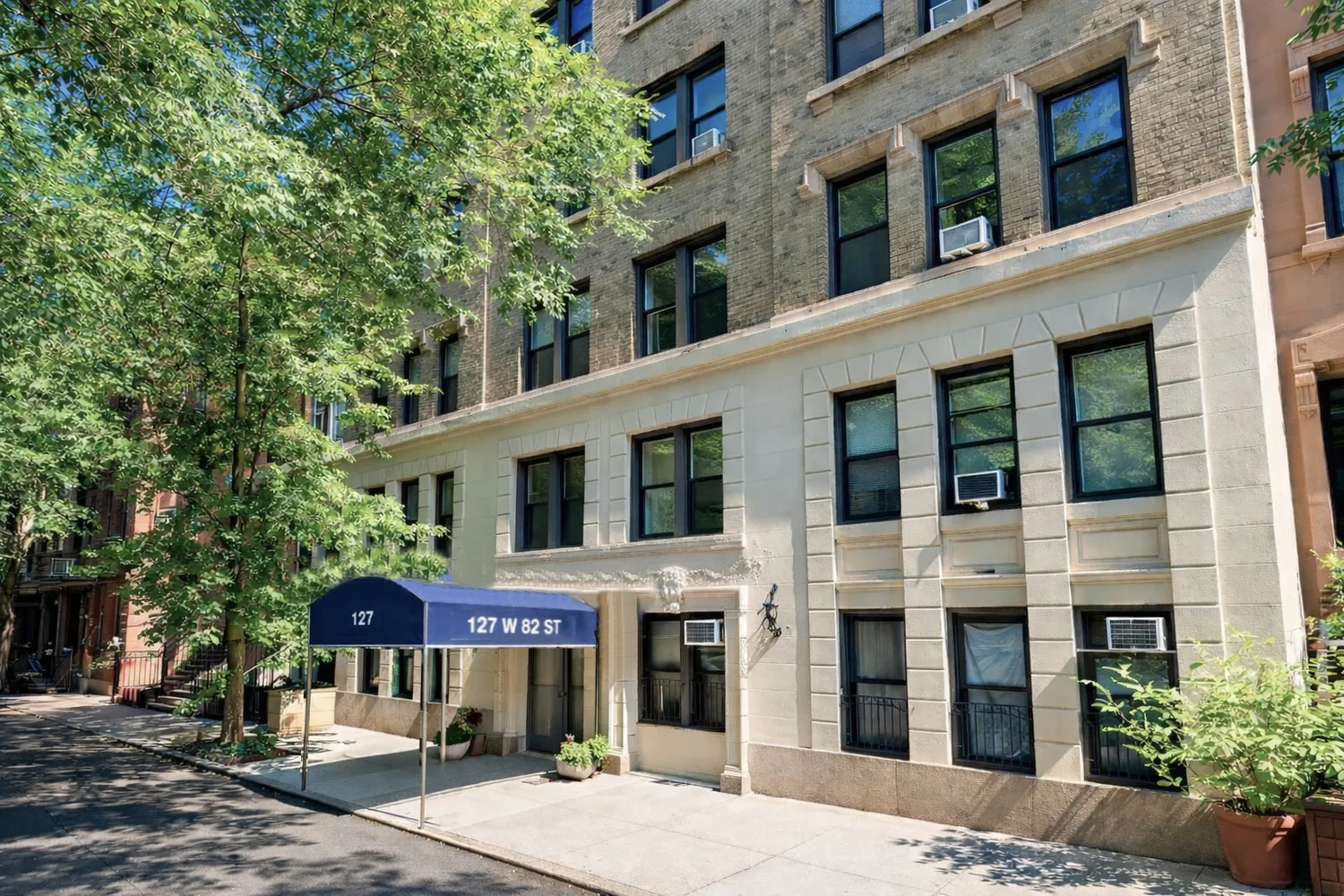 a front view of a building with street view