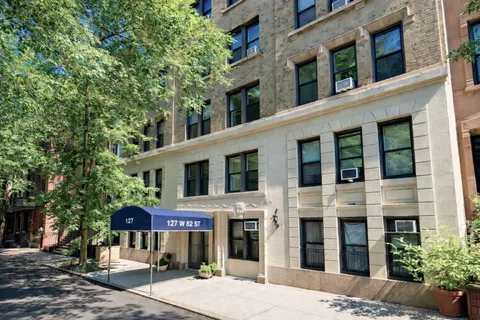 a front view of a building with street view