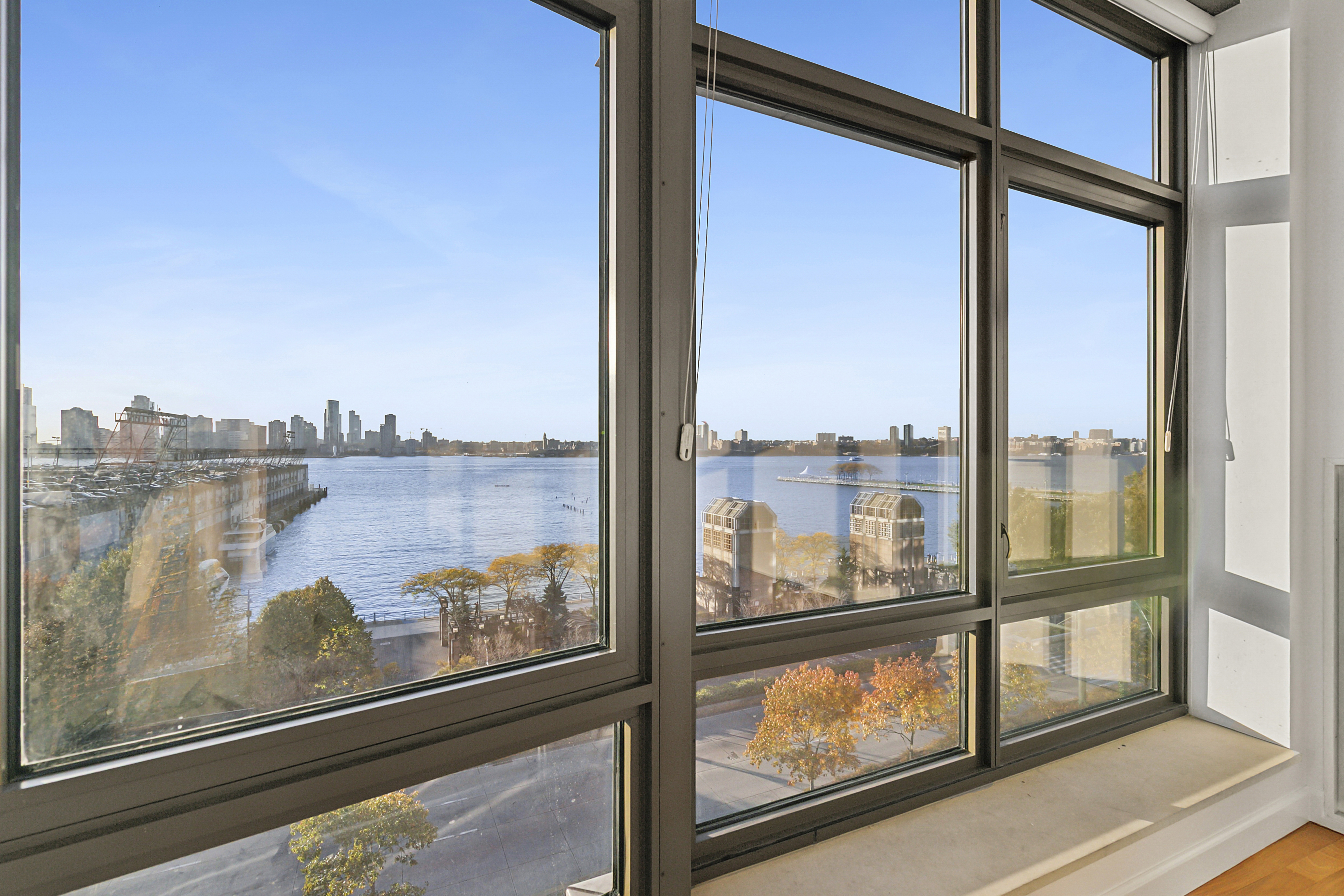 100 Morton Street, Unit 6CW Manhattan, NY 10014 - Photo 4 of 12 a view of a lake from a window