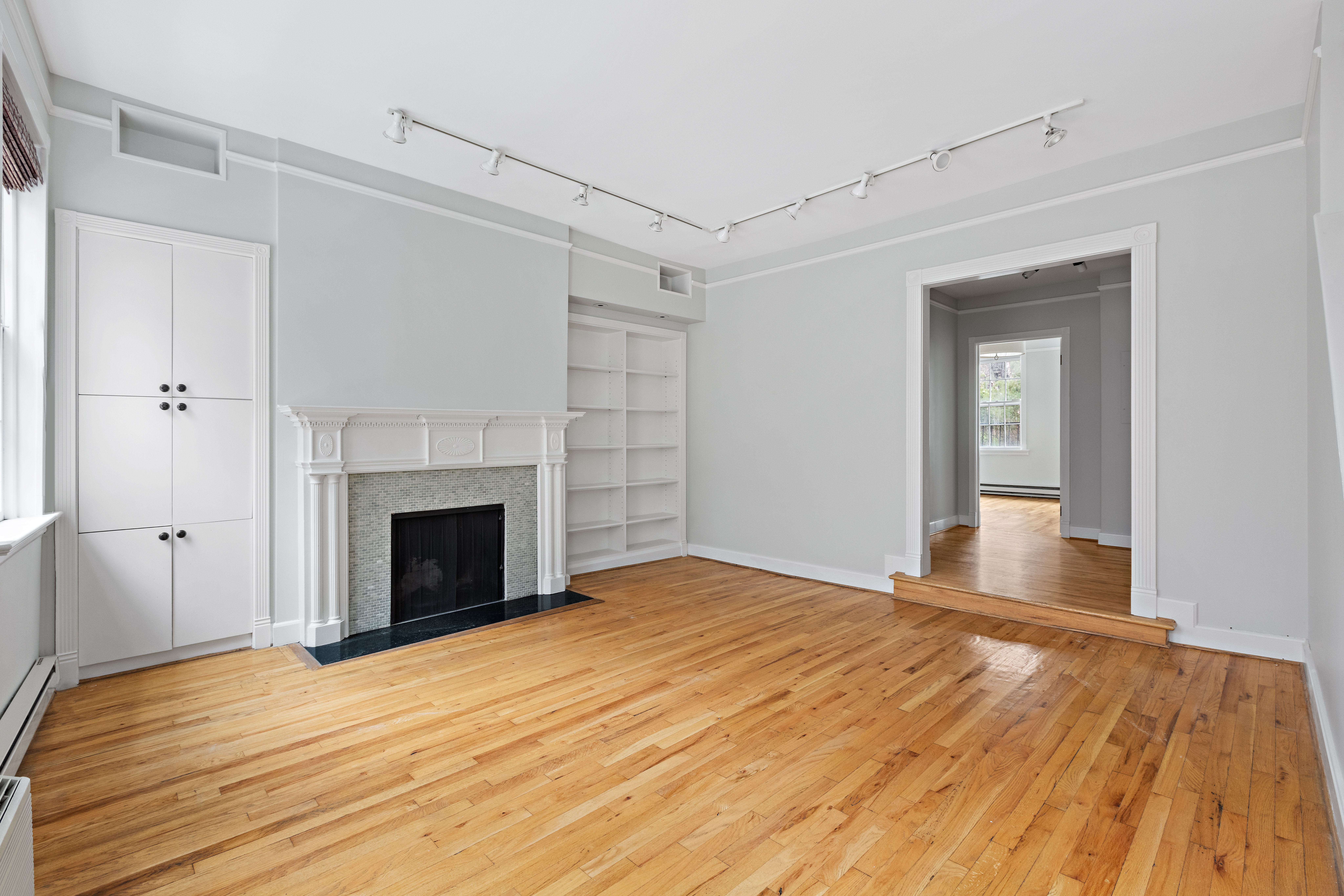 10 Bedford Street Manhattan, NY 10014 - Photo 6 of 29 a view of empty room with wooden floor and fireplace