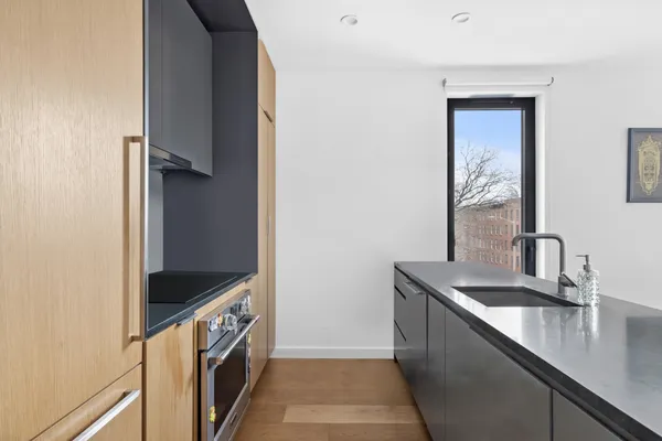 a kitchen with a sink and a refrigerator