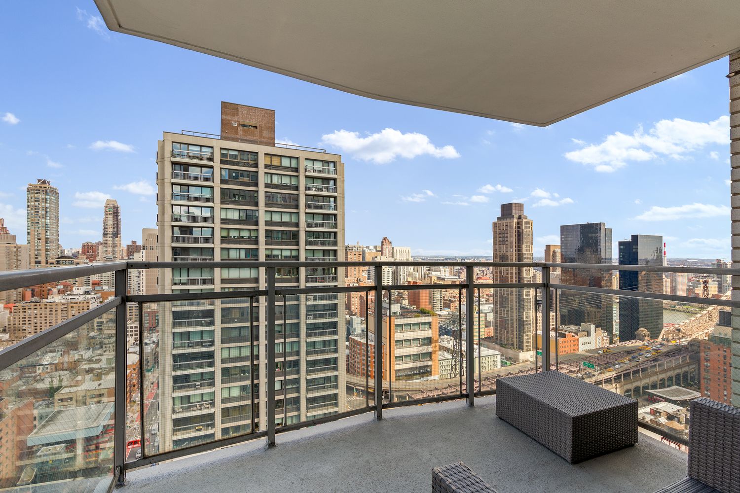 303 East 57th Street, Unit 30E Manhattan, NY 10022 - Photo 9 of 10 a view of roof with city view