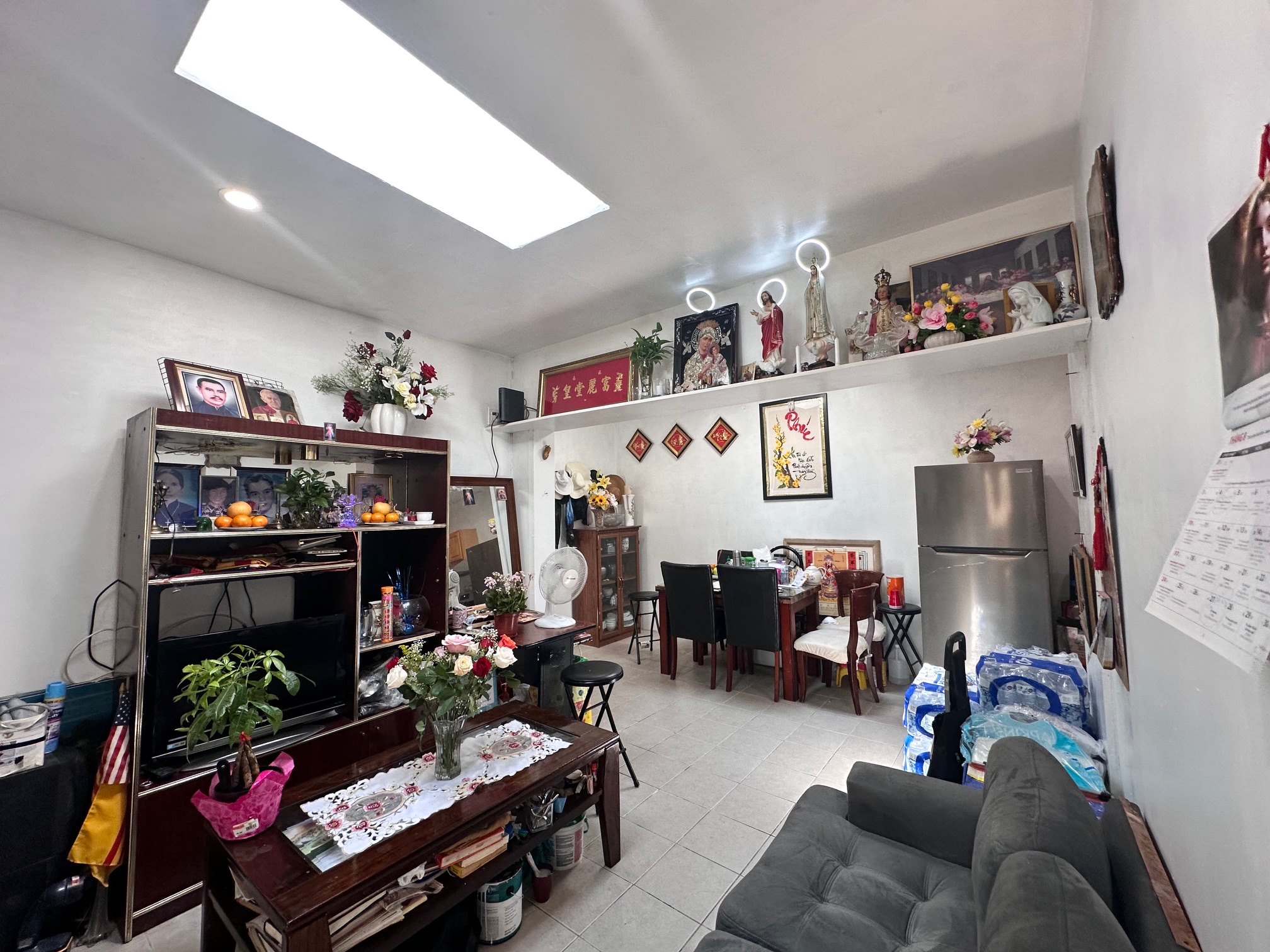 41-34 39th Street Queens, NY 11101 - Photo 6 of 10 a living room with furniture and a flat screen tv