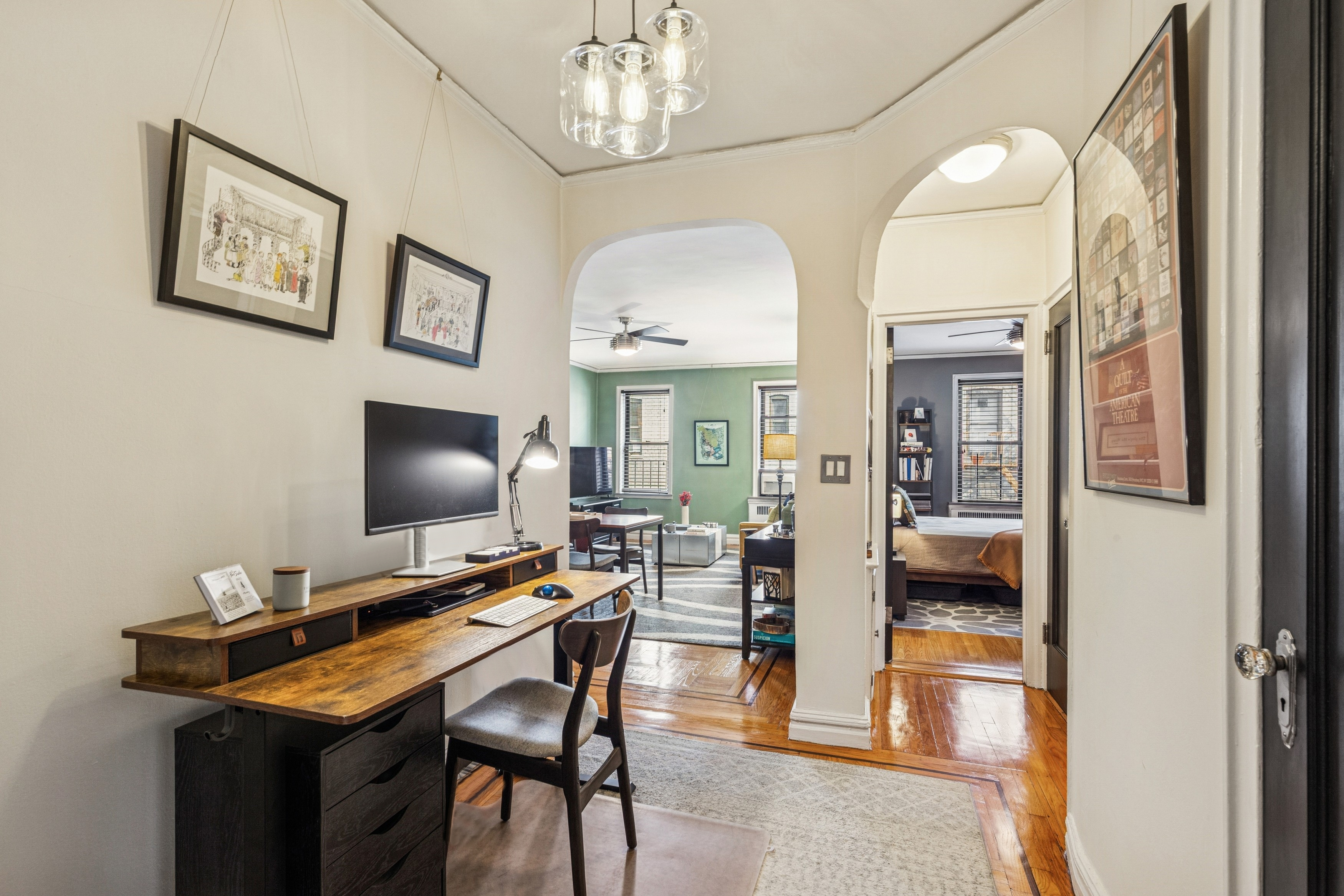 60 Cooper Street, Unit 5J Manhattan, NY 10034 - Photo 1 of 17 a view of a dining room with furniture and chandelier