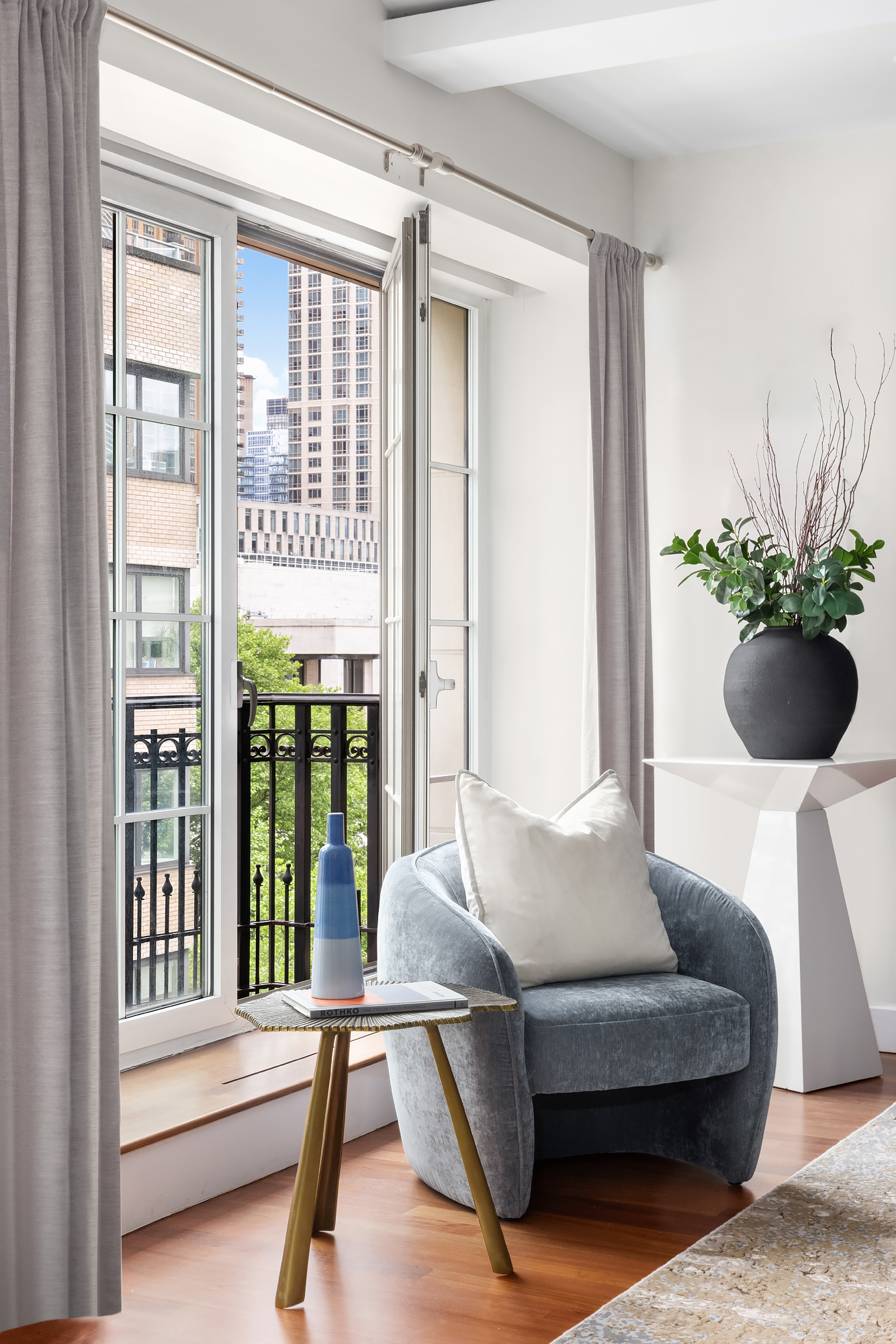 43 West 64th Street, Unit 7A Manhattan, NY 10023 - Photo 5 of 20 a living room with furniture and a potted plant