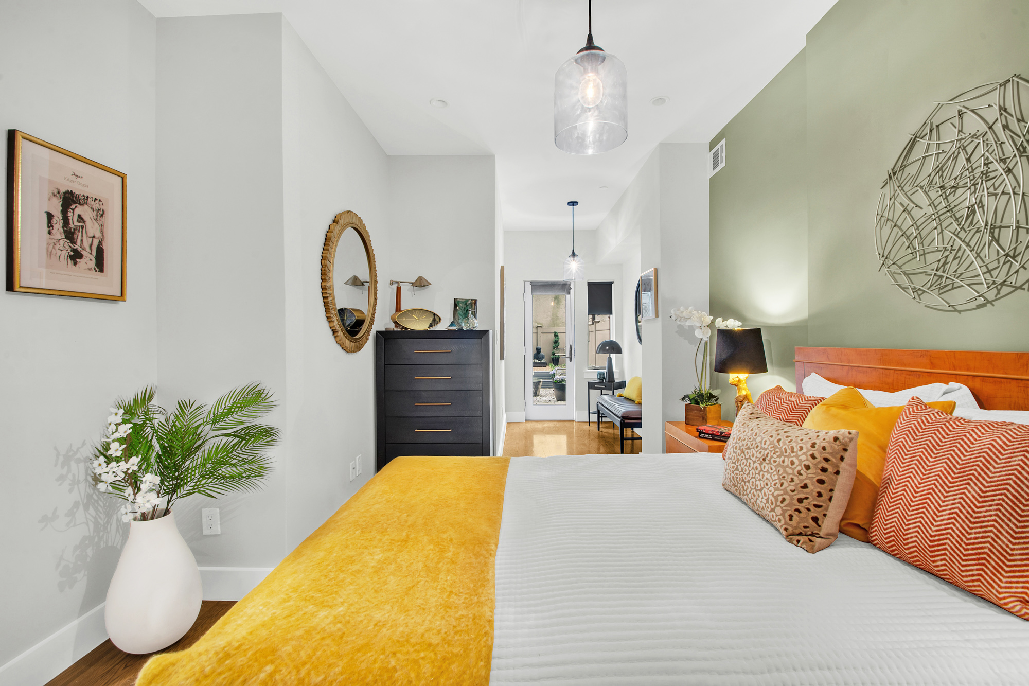 159 West 126th Street, Unit GARDEN A Manhattan, NY 10027 - Photo 7 of 15 a spacious bedroom with bed and a chandelier