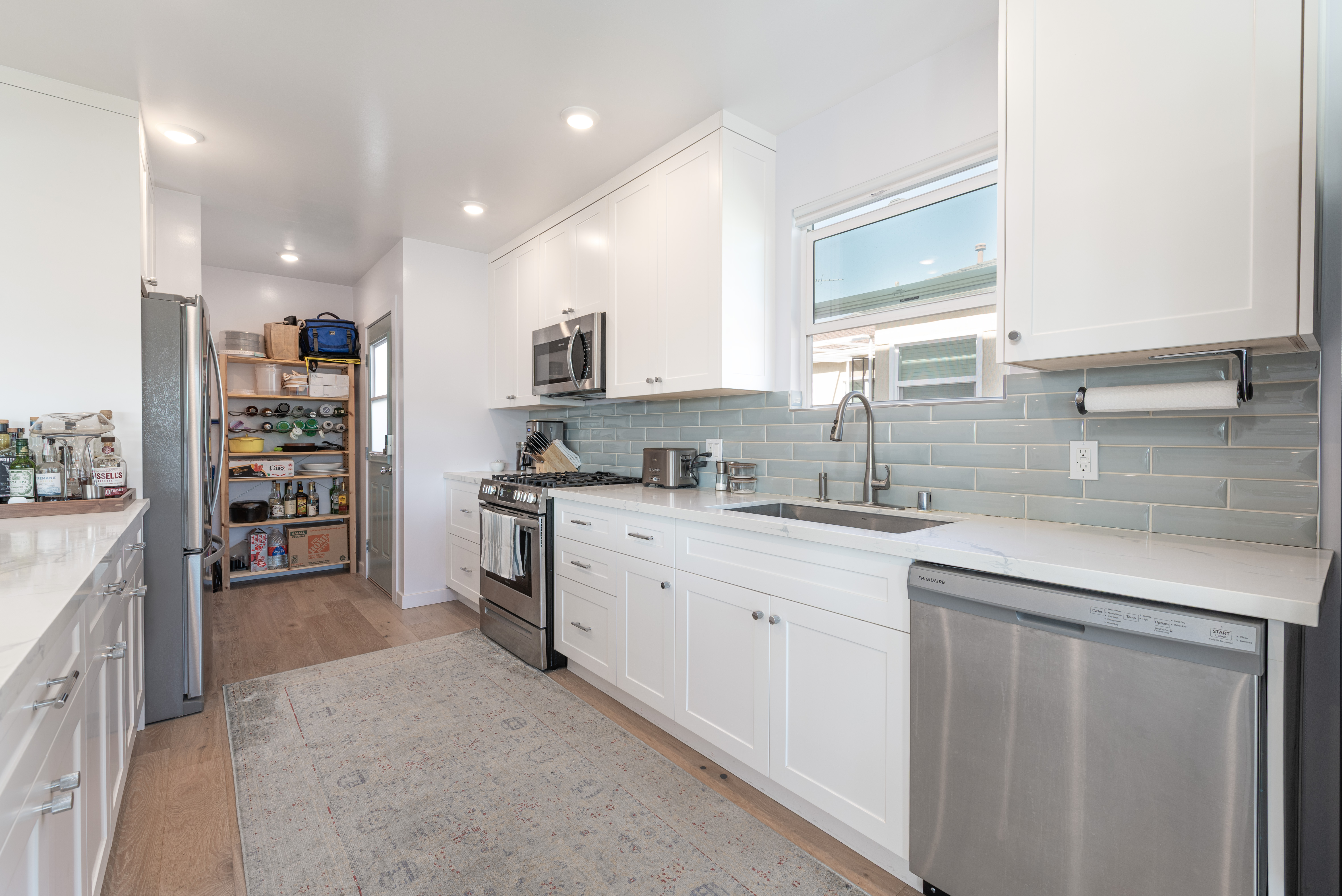1005 Alexandria Avenue Los Angeles, CA 90029 - Photo 6 of 21 a kitchen with stainless steel appliances granite countertop a sink and a refrigerator