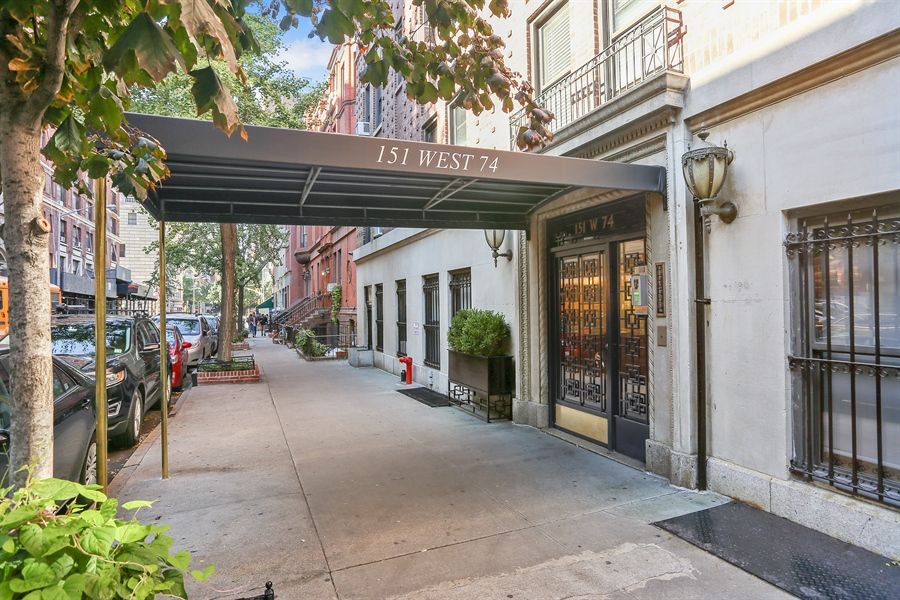 a view of a patio with table and chairs potted plants