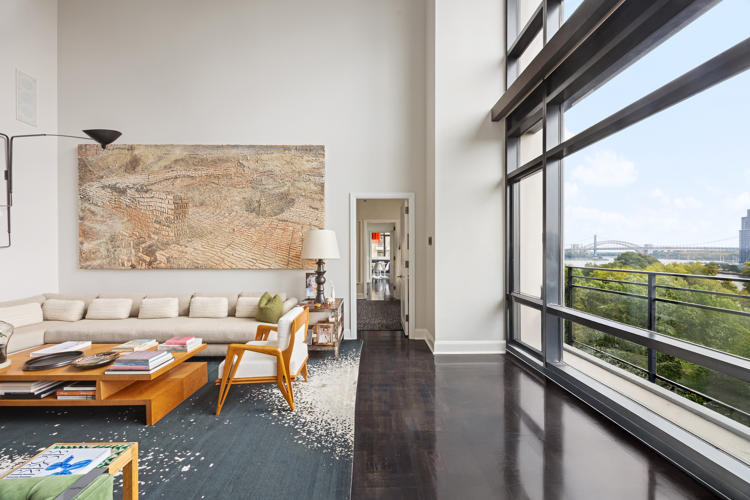 170 East End Avenue, Unit 8EF Manhattan, NY 10128 - Photo 3 of 34 a living room with furniture and a floor to ceiling window