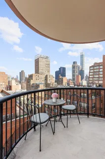 a view of a tall building from a balcony