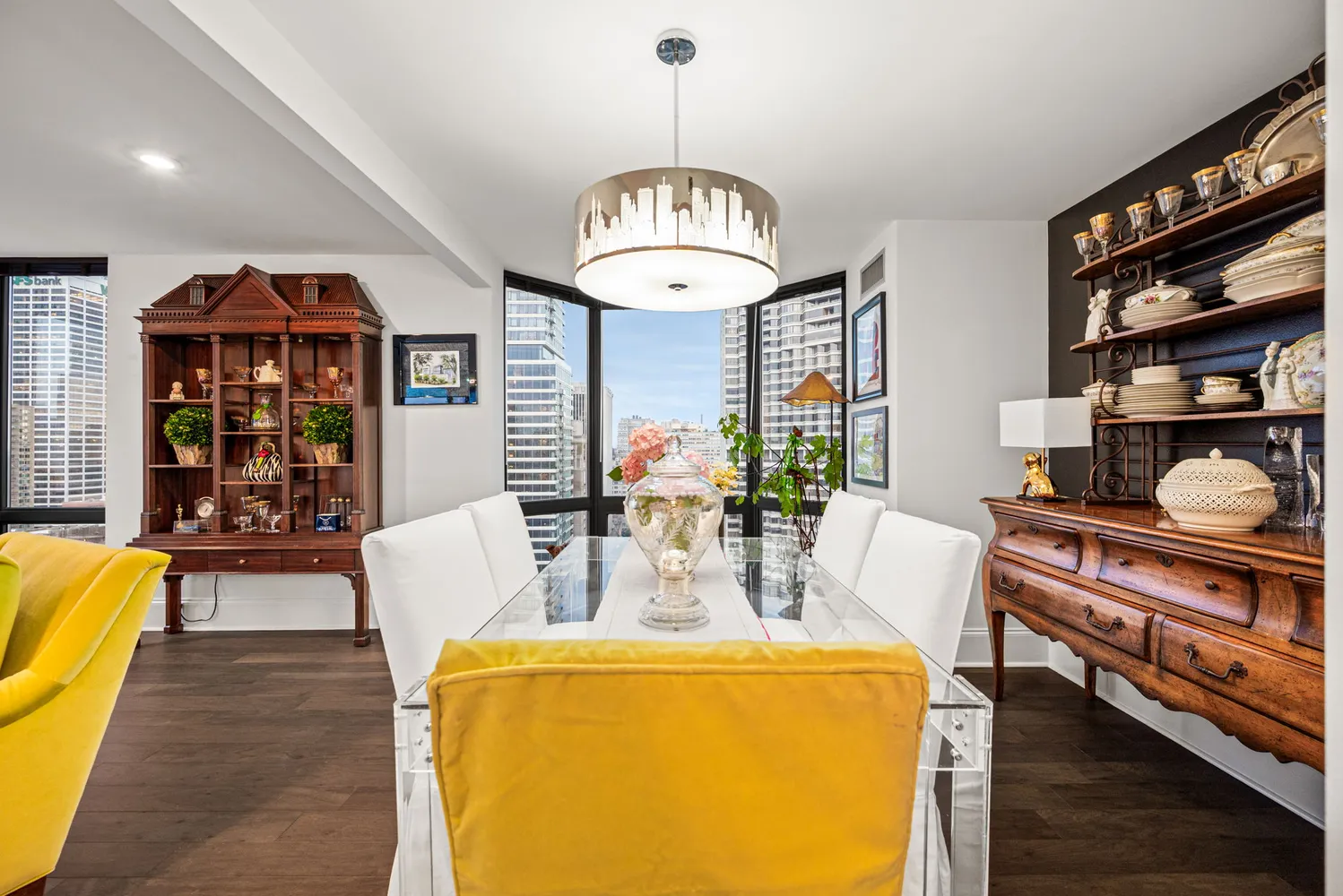 a dining room with furniture and wooden floor