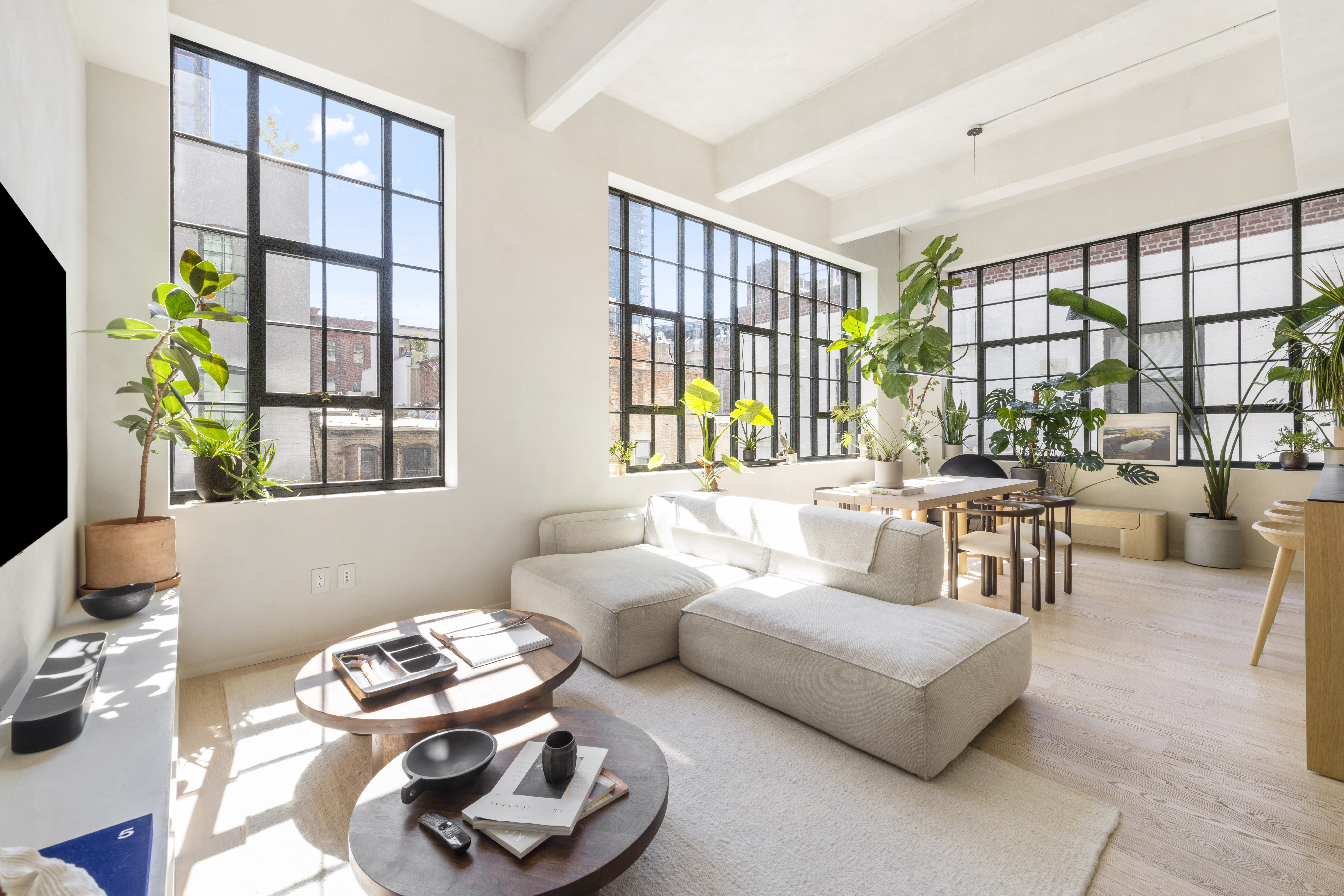 168 Plymouth Street, Unit 5A Brooklyn, NY 11201 - Photo 2 of 19 a living room with furniture and a floor to ceiling window