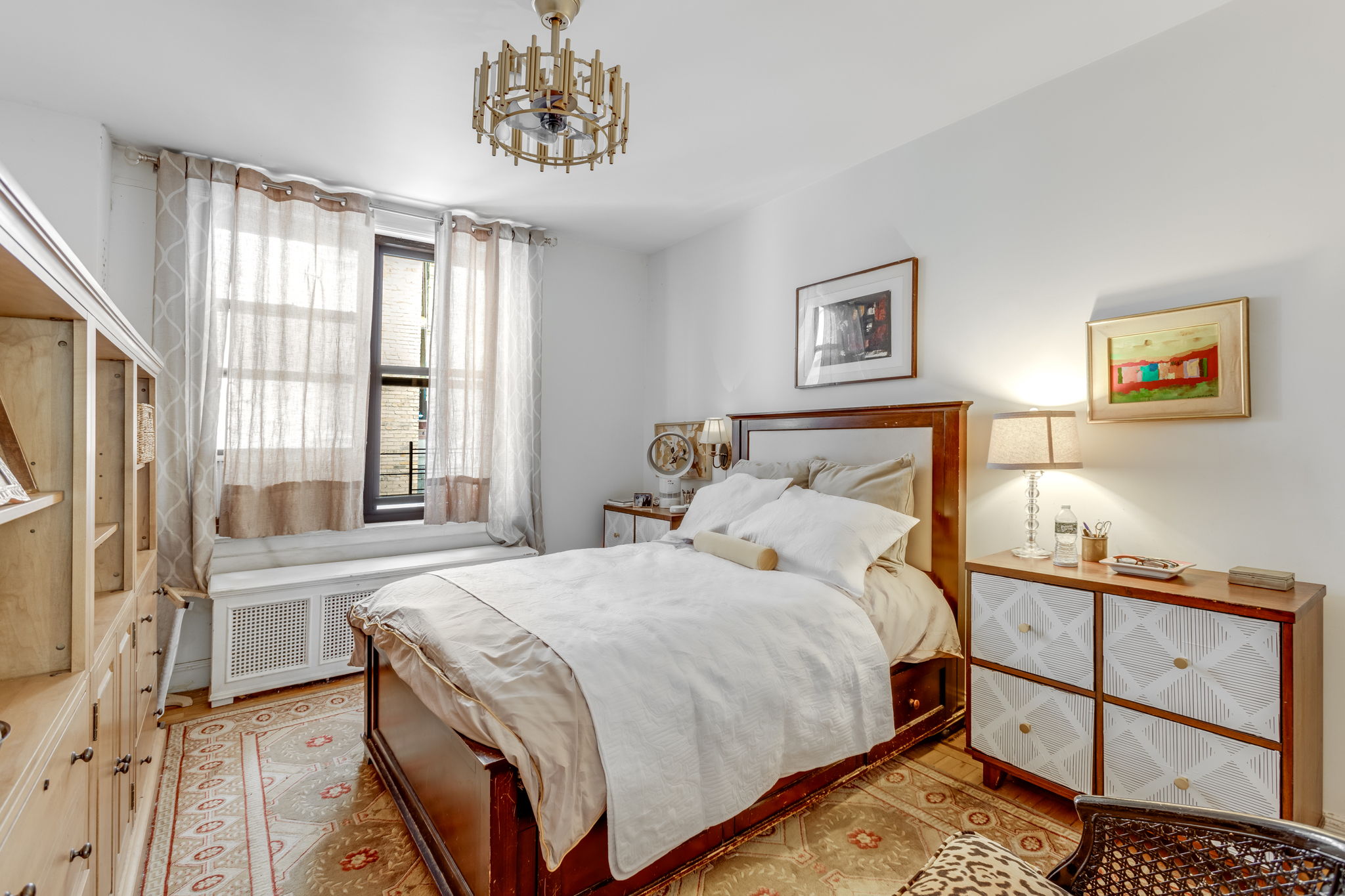 345 East 77th Street, Unit 3C Manhattan, NY 10075 - Photo 5 of 8 a bedroom with a bed and a window