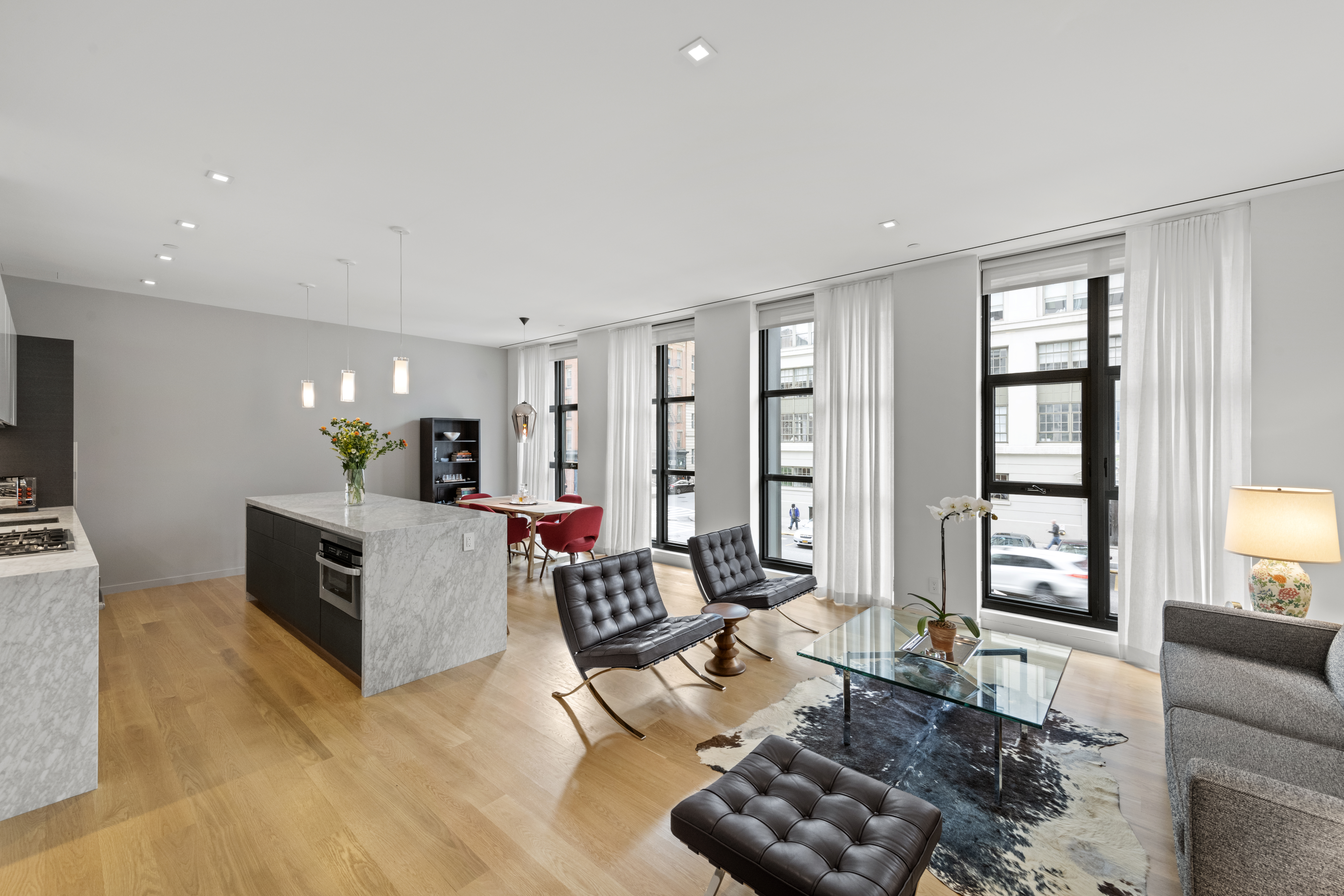 11 North Moore Street, Unit 2B Manhattan, NY 10013 - Photo 3 of 12 a living room with furniture and a flat screen tv