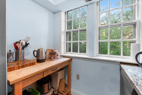 a kitchen with a sink and a window