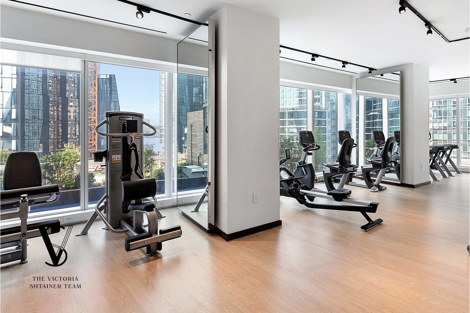 1 West End Avenue, Unit 28C Manhattan, NY 10023 - Photo 23 of 26 a view of a livingroom with gym equipment and floor to ceiling window