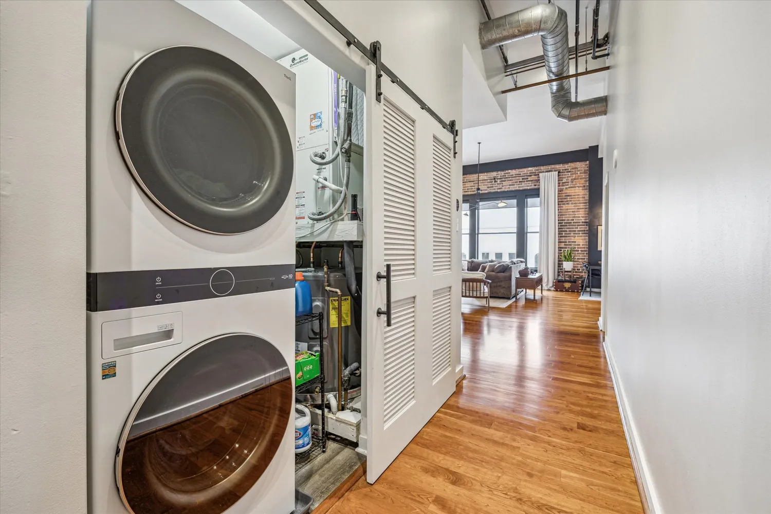 a view of a hallway with washer and dryer