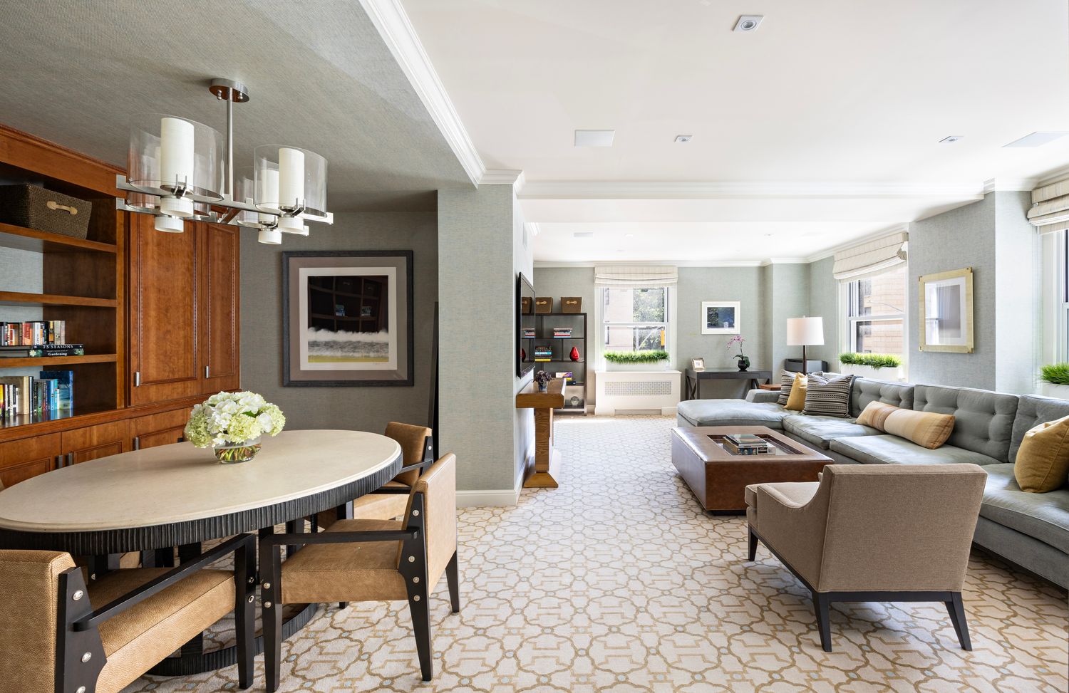 a living room with furniture and a dining table