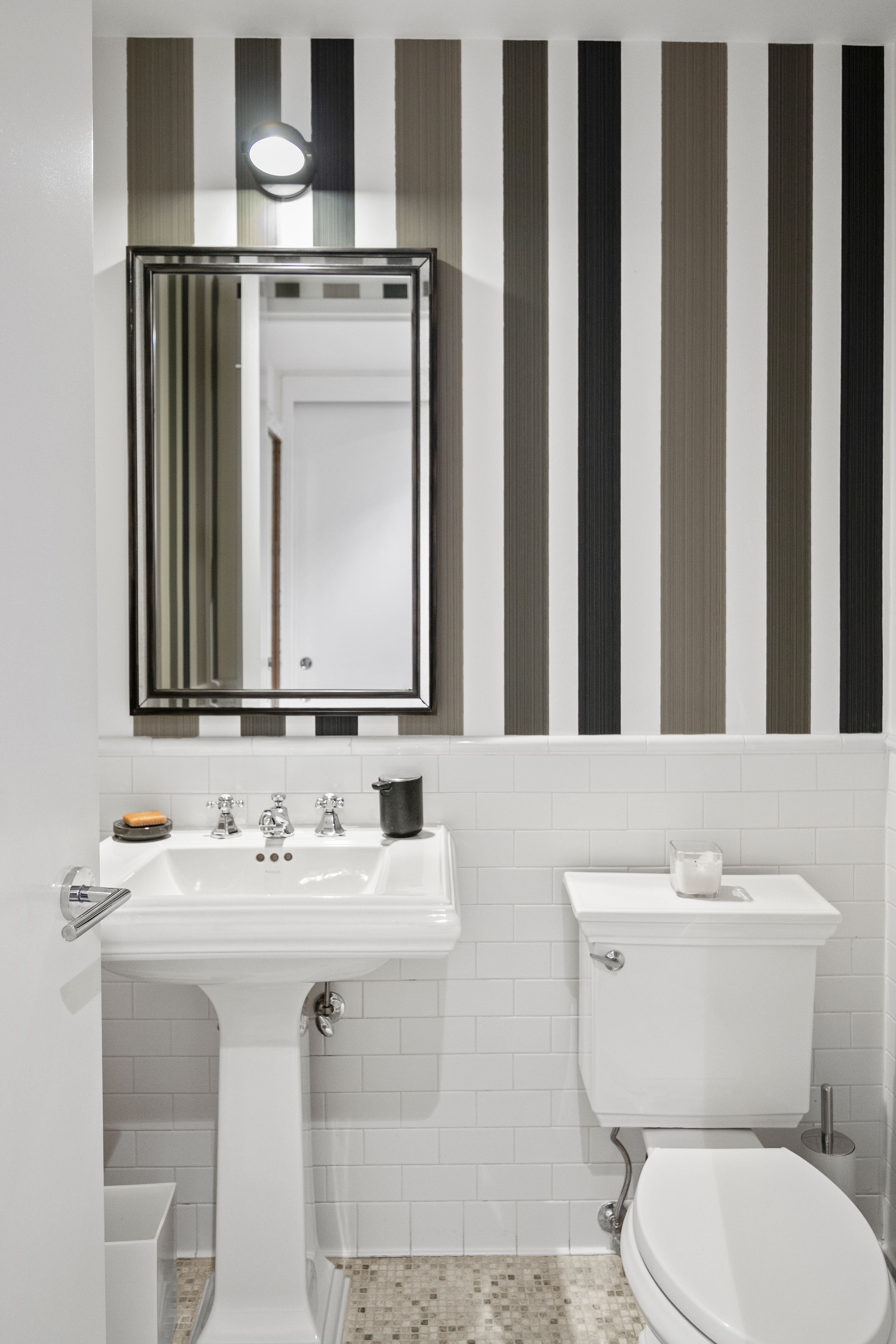 224 West 18th Street, Unit 6C Manhattan, NY 10011 - Photo 15 of 21 a bathroom with a toilet a sink and a mirror