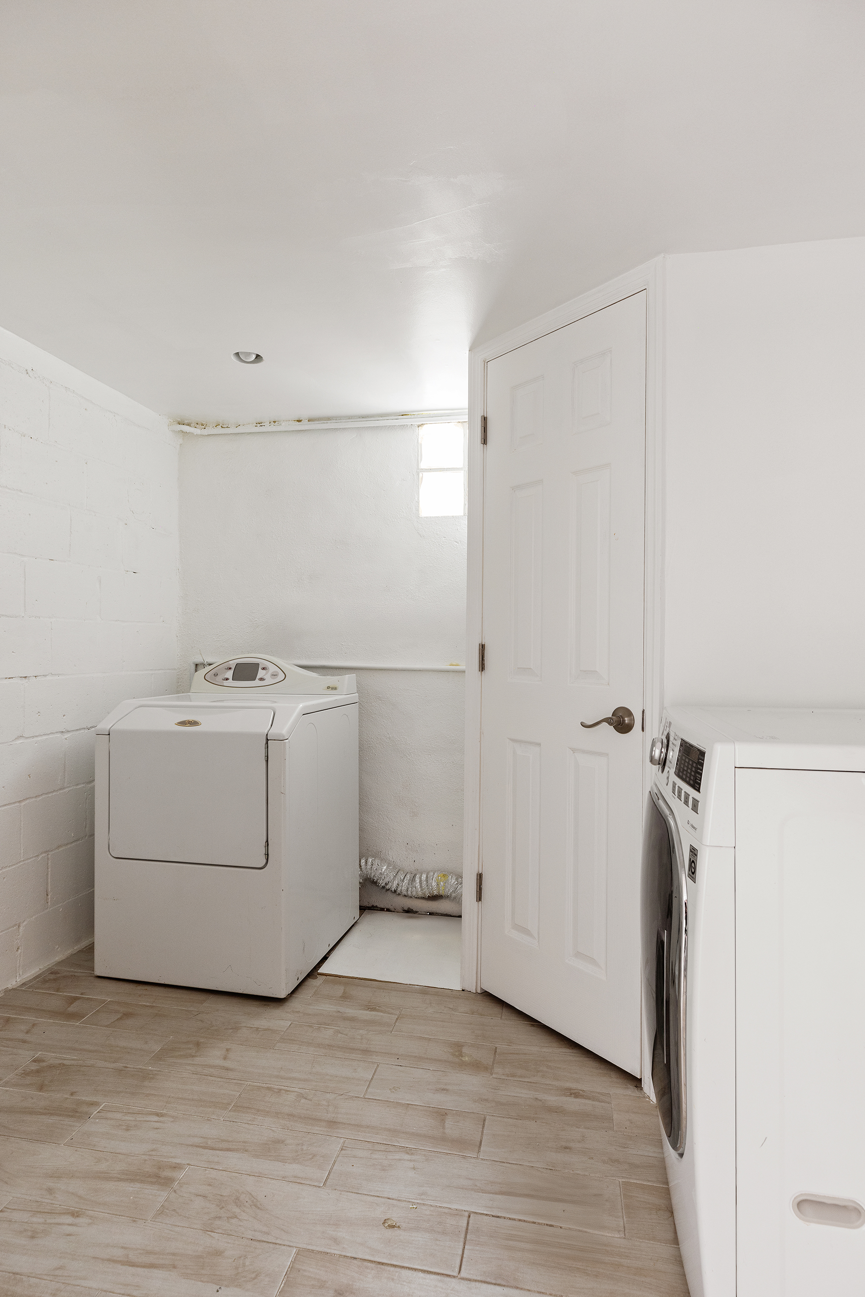 412 Classon Avenue Brooklyn, NY 11238 - Photo 13 of 30 a utility room with cabinets washer and dryer