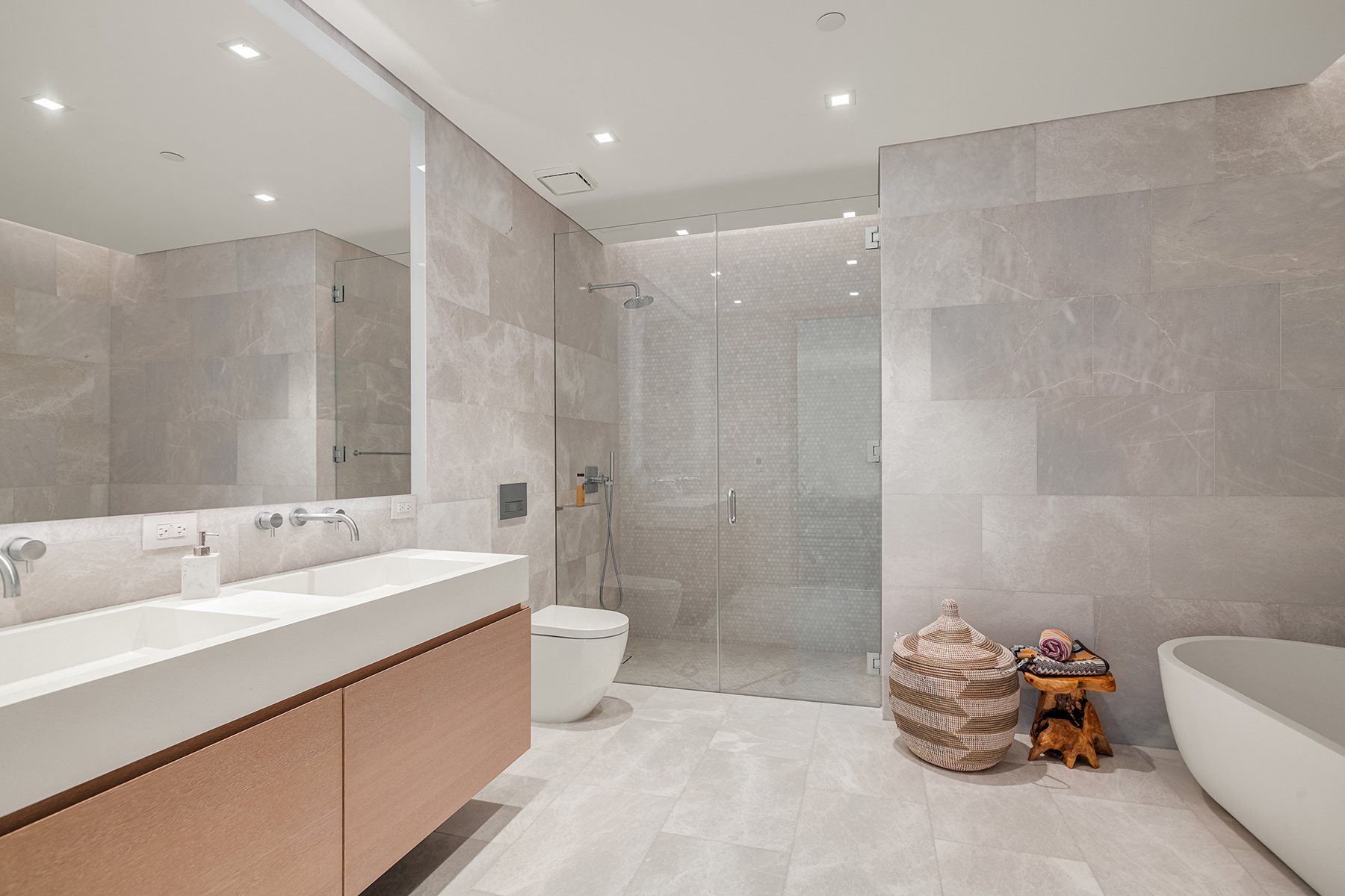 49 Chambers Street, Unit 15B Manhattan, NY 10007 - Photo 6 of 20 a bathroom with a tub sink mirror and toilet