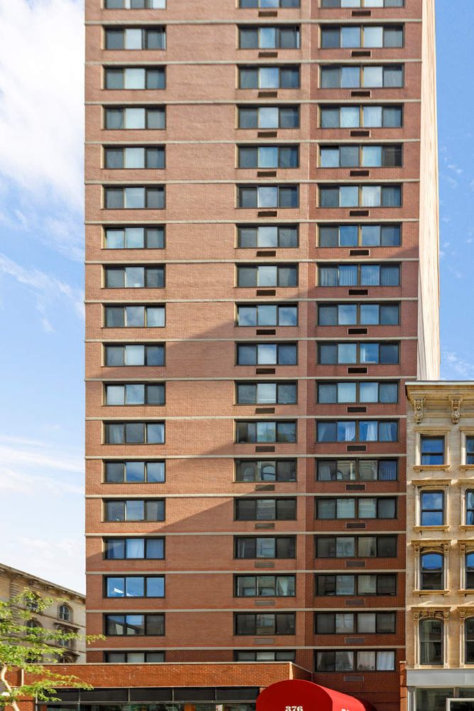 376 Broadway, Unit 8F Manhattan, NY 10013 - Photo 18 of 20 a view of a building with windows