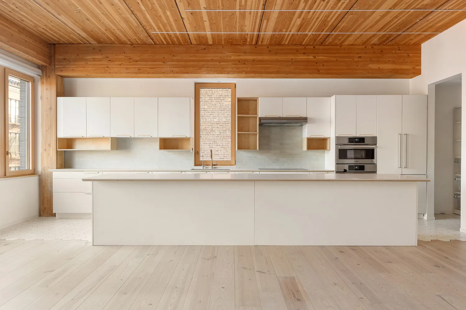 a kitchen with a sink and a window
