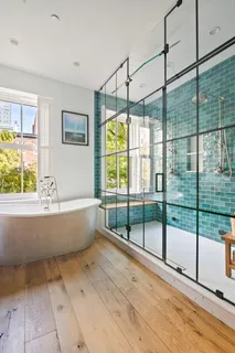 a bathroom with a bathtub and window
