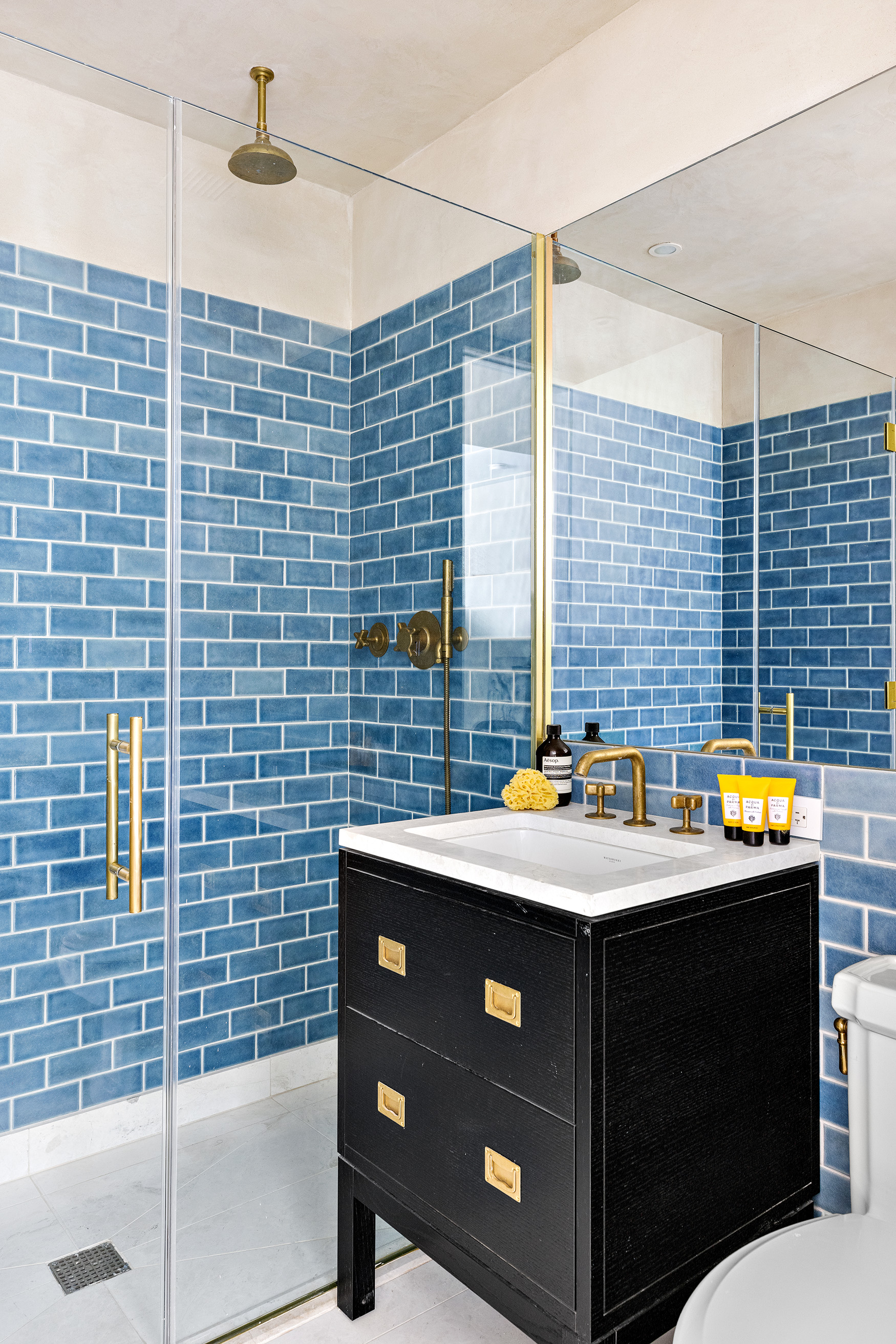 93 Worth Street, Unit 311 Manhattan, NY 10013 - Photo 16 of 17 a bathroom with a sink and a blue shower